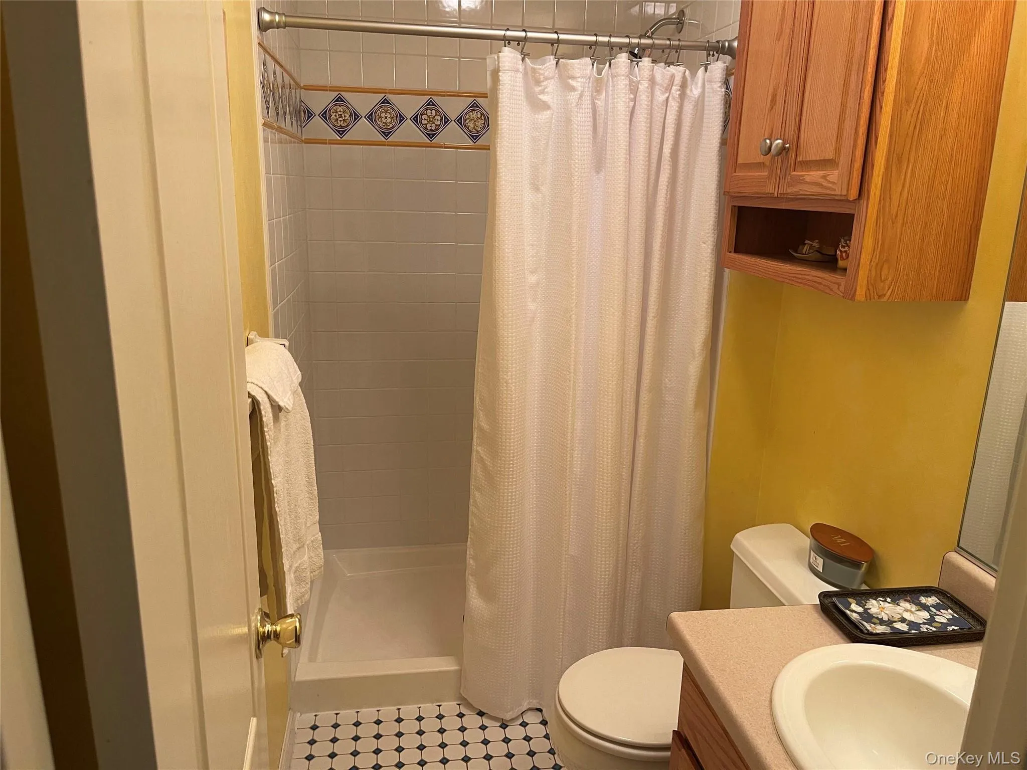 Full bathroom with tiled shower on the first floor. Full bathroom with tiled shower on the first floor.