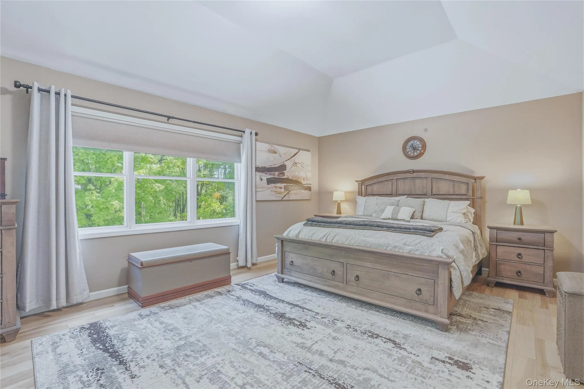 Spacious primary bedroom retreat featuring double walk-in closests and elegand raised tray ceiling. Spacious primary bedroom retreat featuring double walk-in closests and elegand raised tray ceiling.