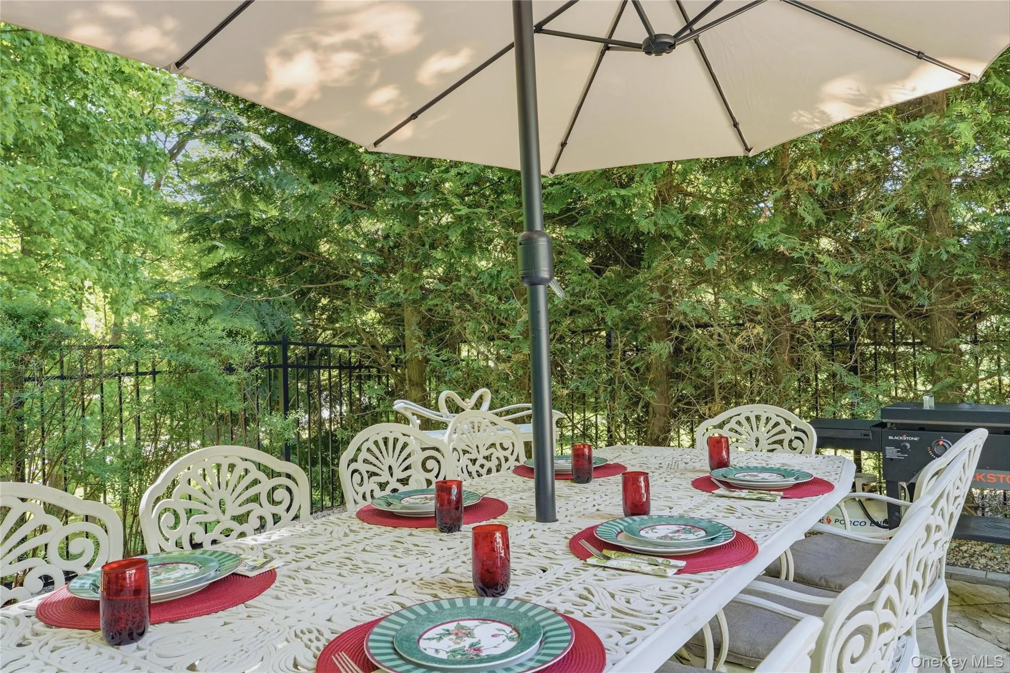 Outdoor entertaining space on pool patio. Outdoor entertaining space on pool patio.