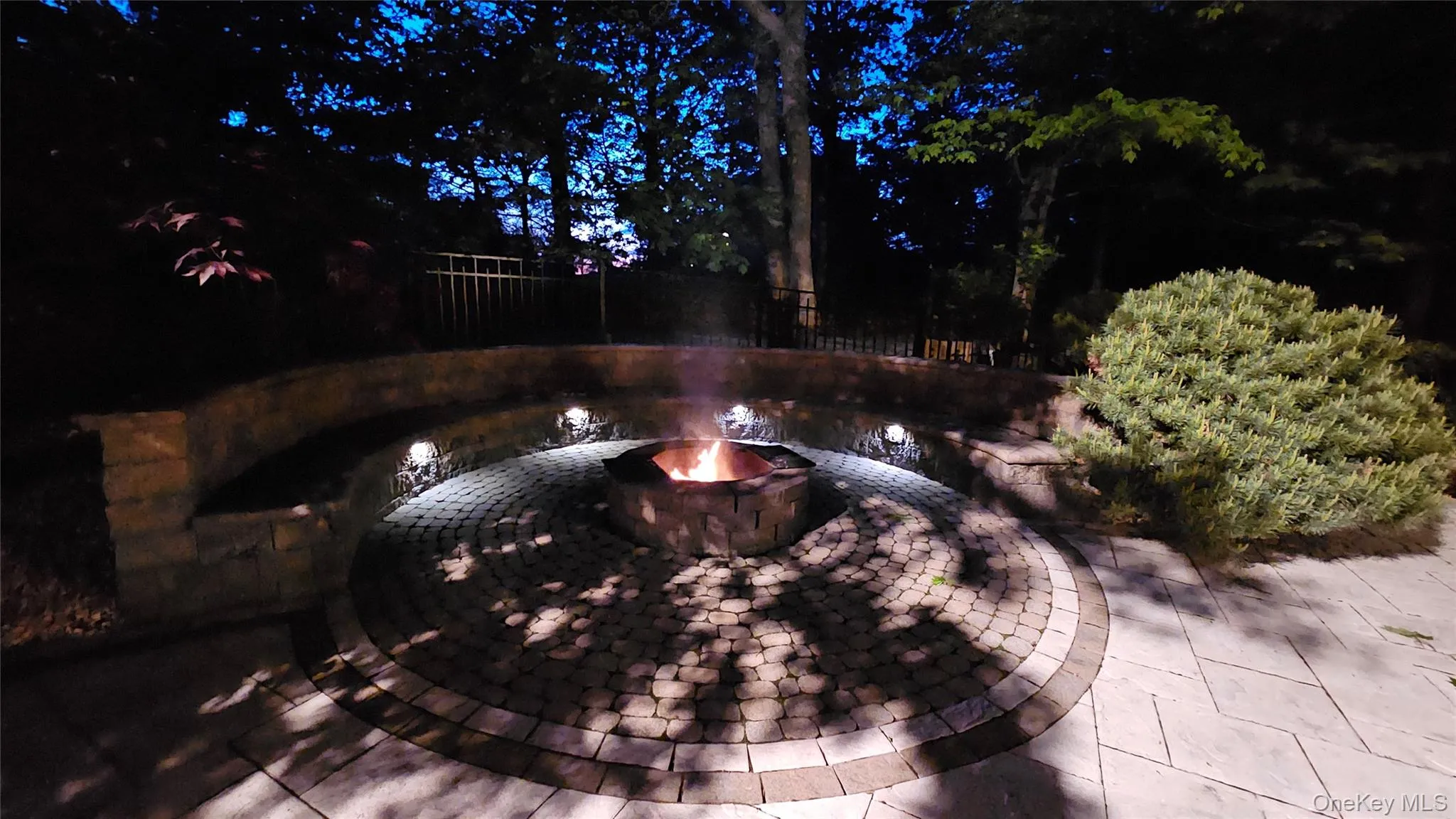 Built in fire pit with landscape lighting. Built in fire pit with landscape lighting.