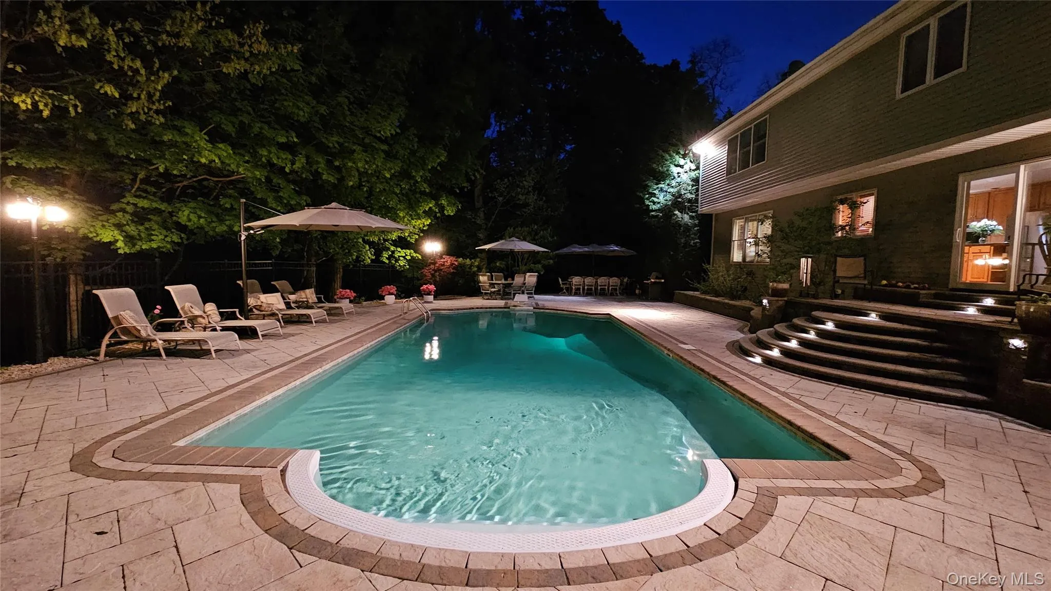 With landscape lighting. With landscape lighting.