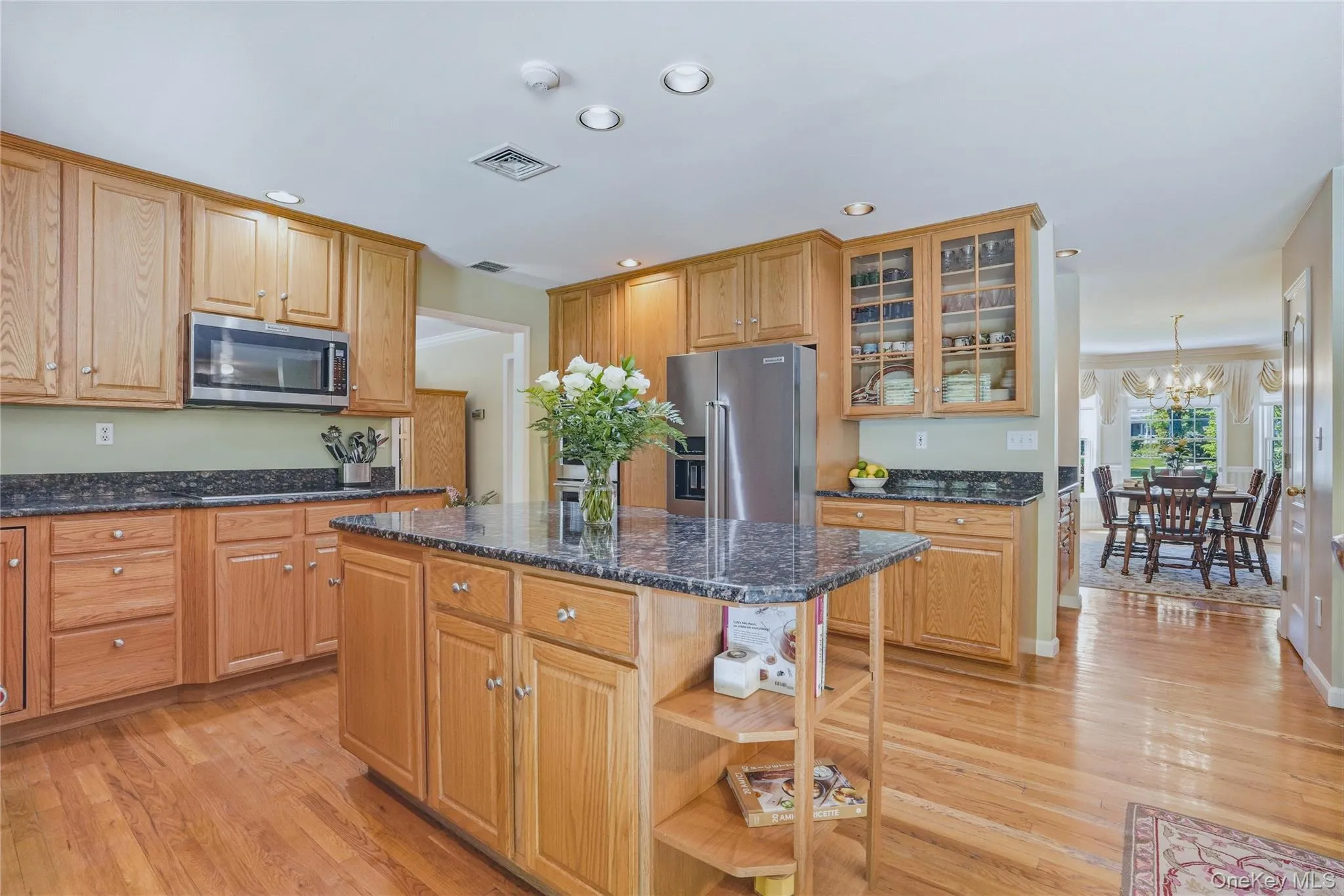 Kitchen with stainless appliances, double oven, Wolf induction stove and walk in pantry. Kitchen with stainless appliances, double oven, Wolf induction stove and walk in pantry.