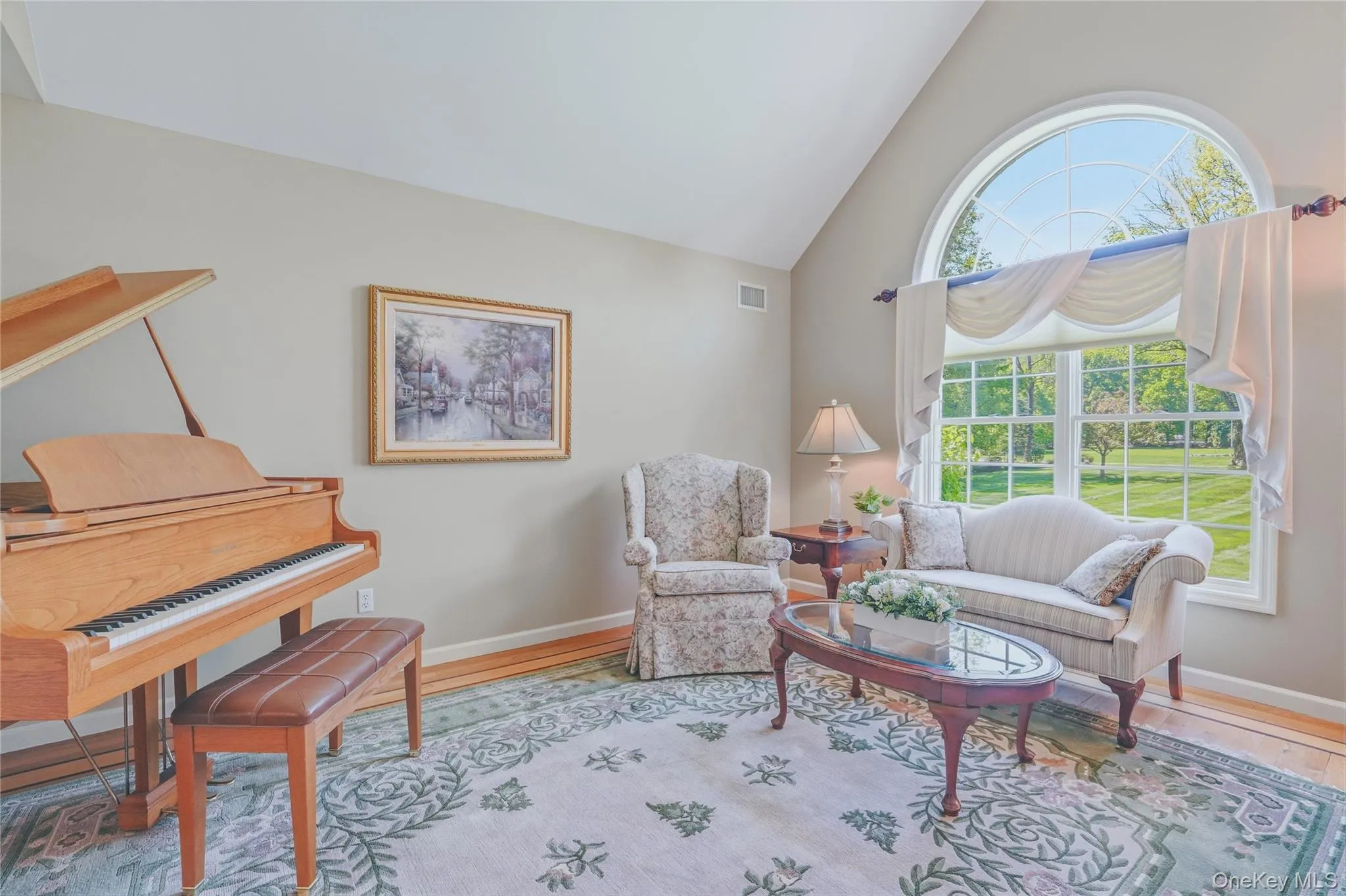 Formal living room with plenty of natural light and vaulted ceilings. Formal living room with plenty of natural light and vaulted ceilings.