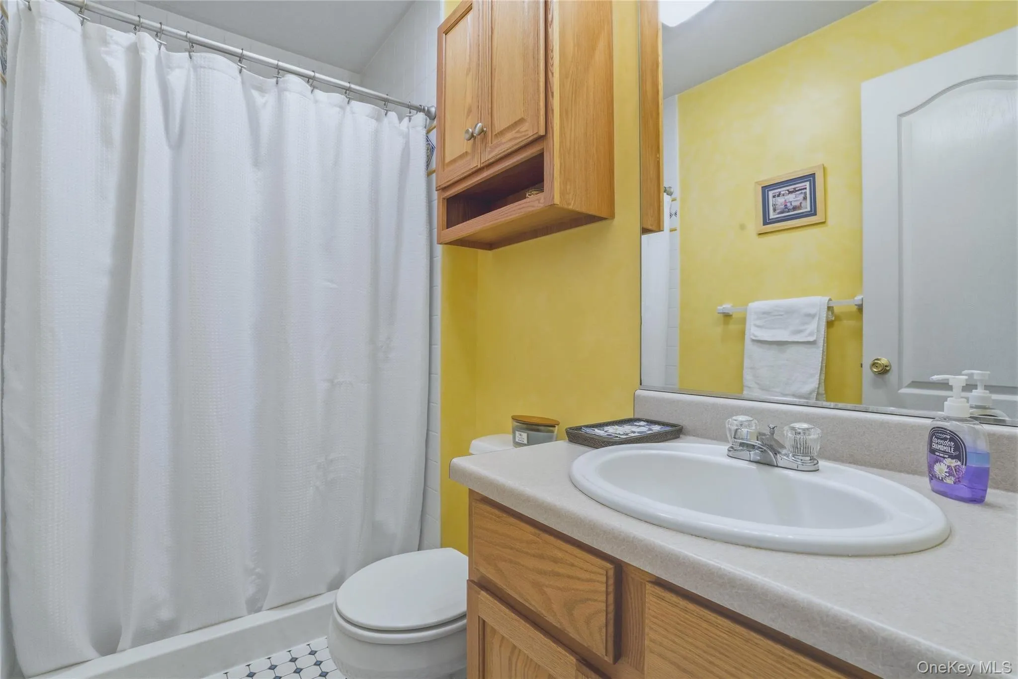 Full bathroom with tiled shower on the first floor. Full bathroom with tiled shower on the first floor.