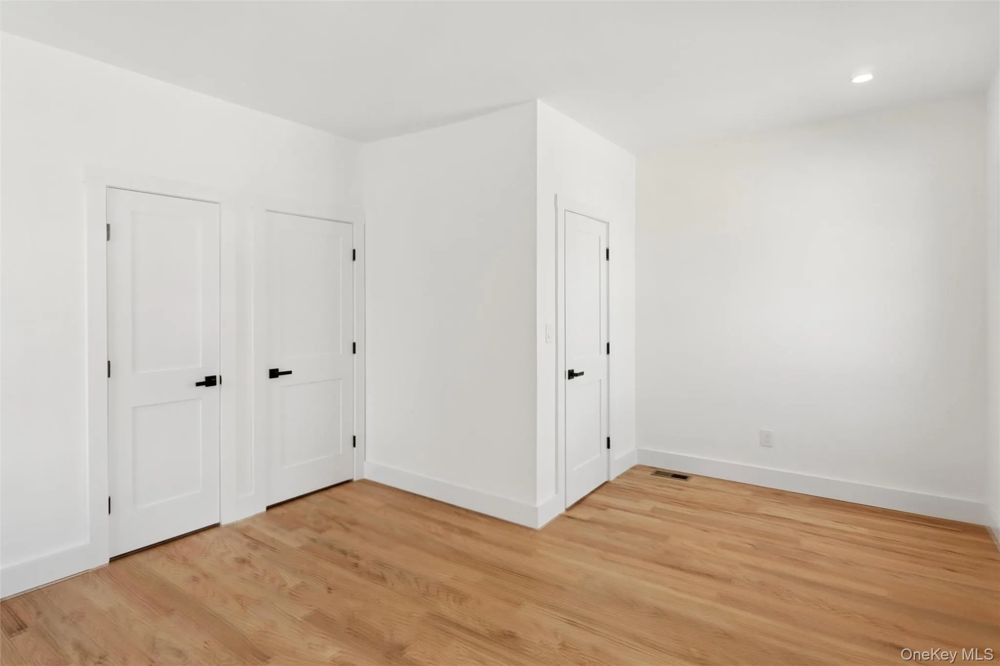 This room features hardwood floors and crisp white walls This room features hardwood floors and crisp white walls