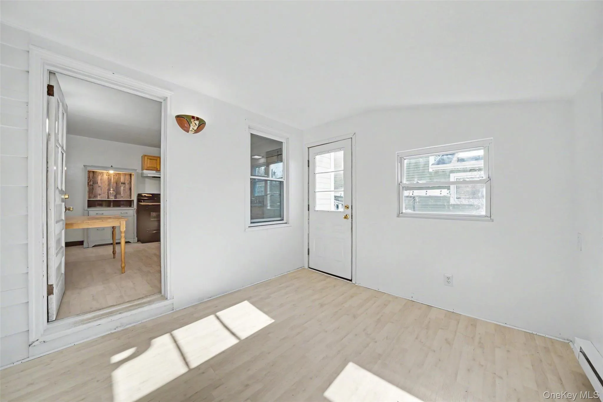 Right off the kitchen in the sun room. Perfect for a den, dining area, or extra pantry storage. Right off the kitchen in the sun room. Perfect for a den, dining area, or extra pantry storage.