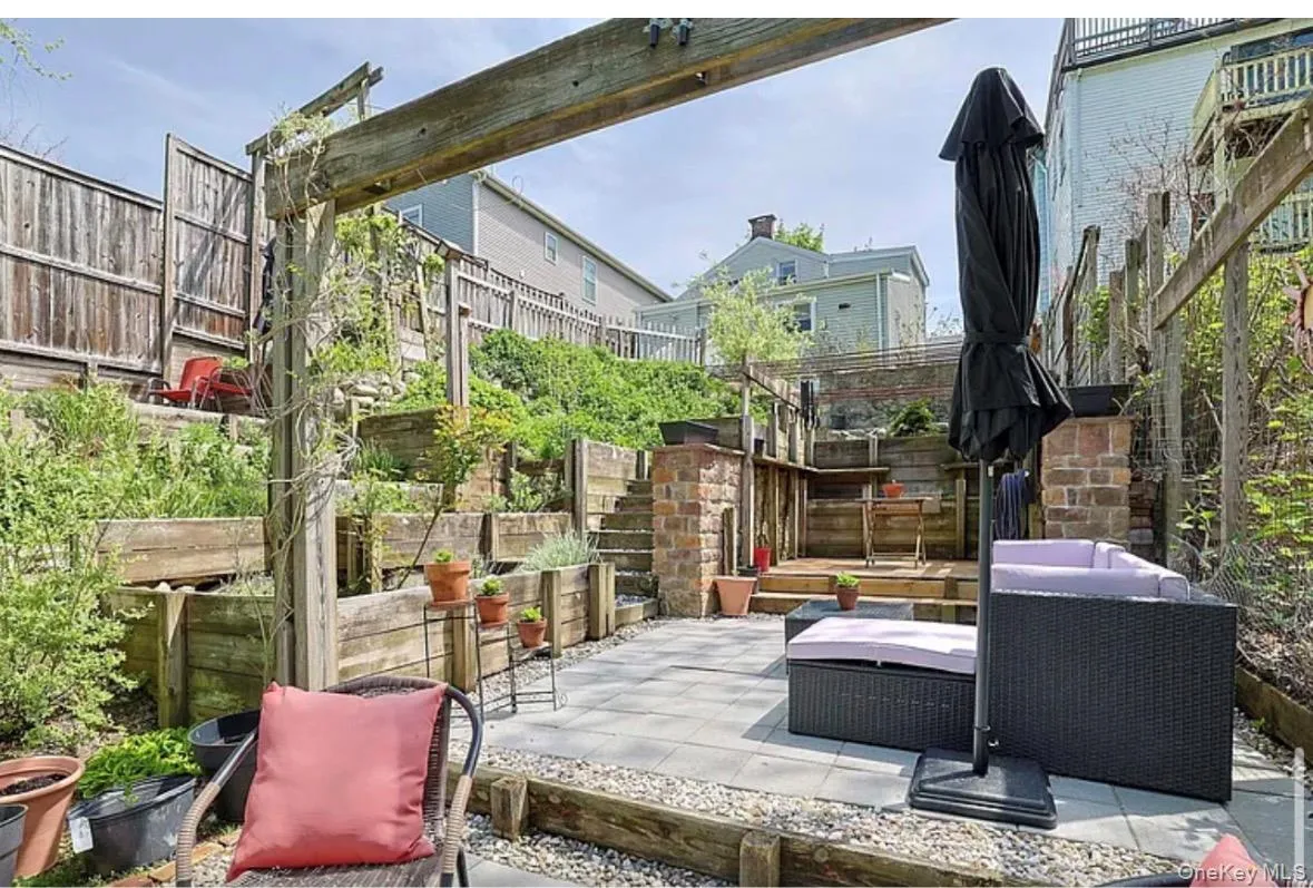 located in the rear of the property that transports you out of the city and into a suburban oasis. located in the rear of the property that transports you out of the city and into a suburban oasis.