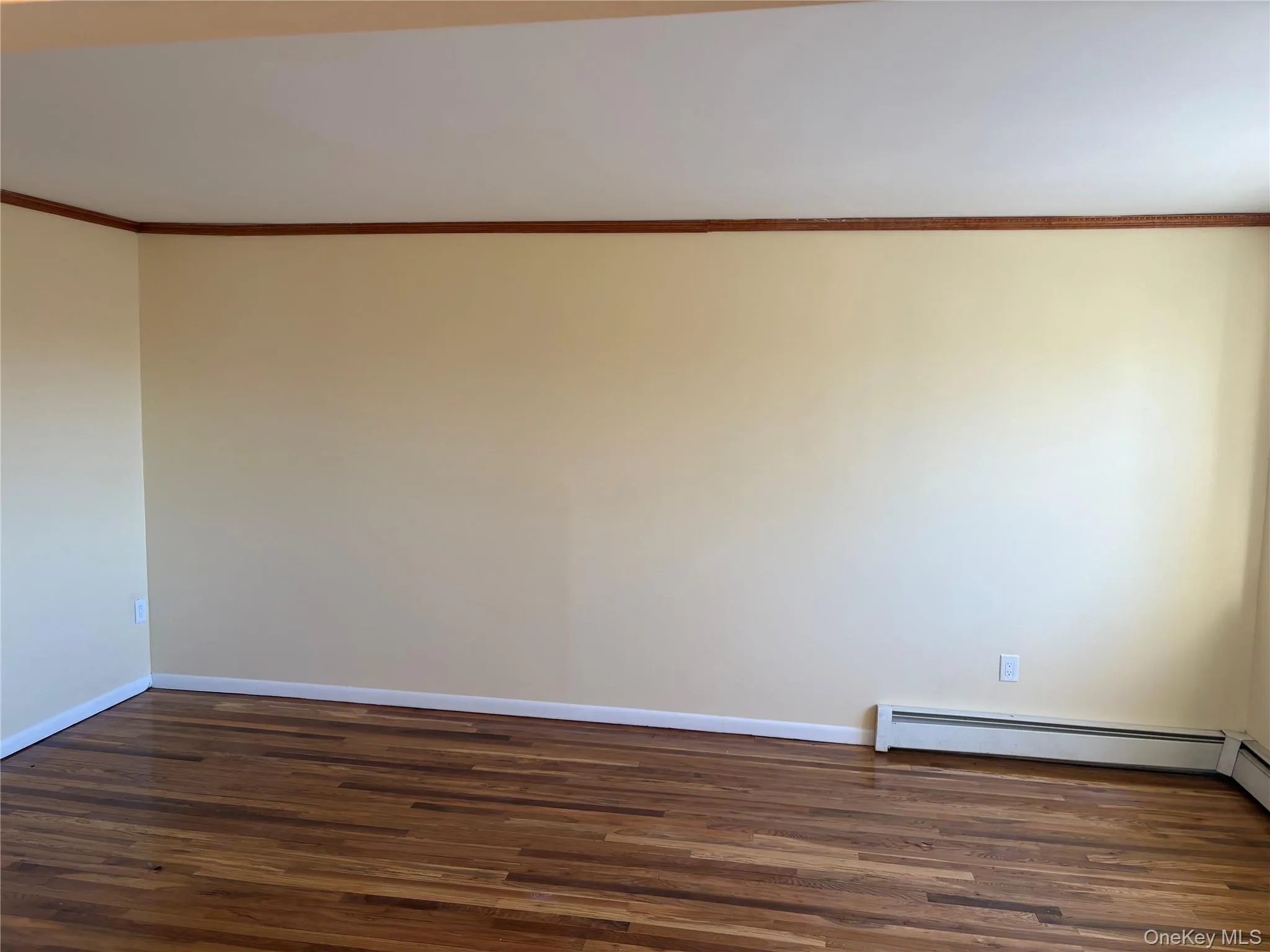 Bedroom room with wood- flooring and crown molding Bedroom room with wood- flooring and crown molding