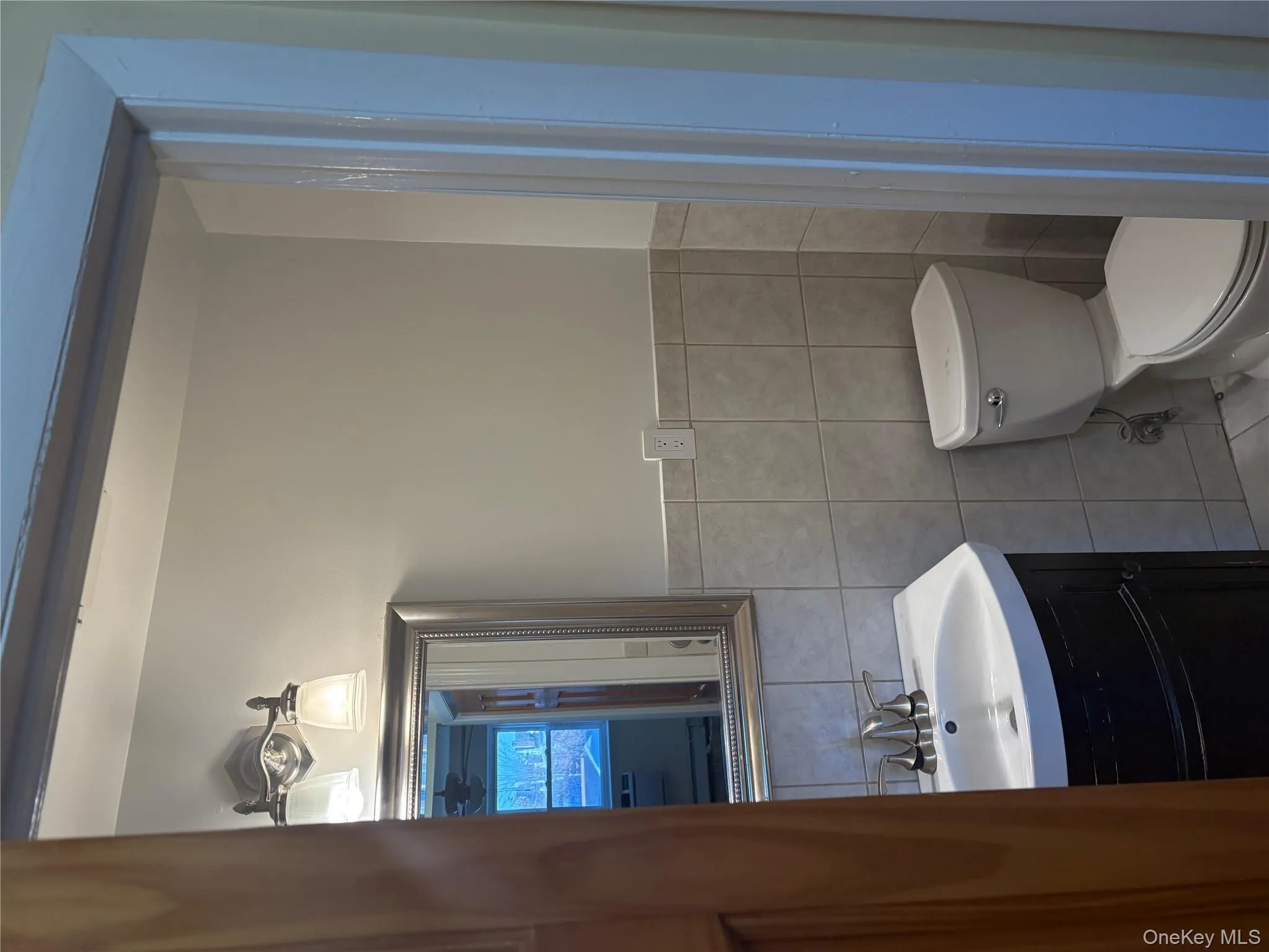 Master Bedroom Bathroom with vanity, tile walls, and wainscoting Master Bedroom Bathroom with vanity, tile walls, and wainscoting