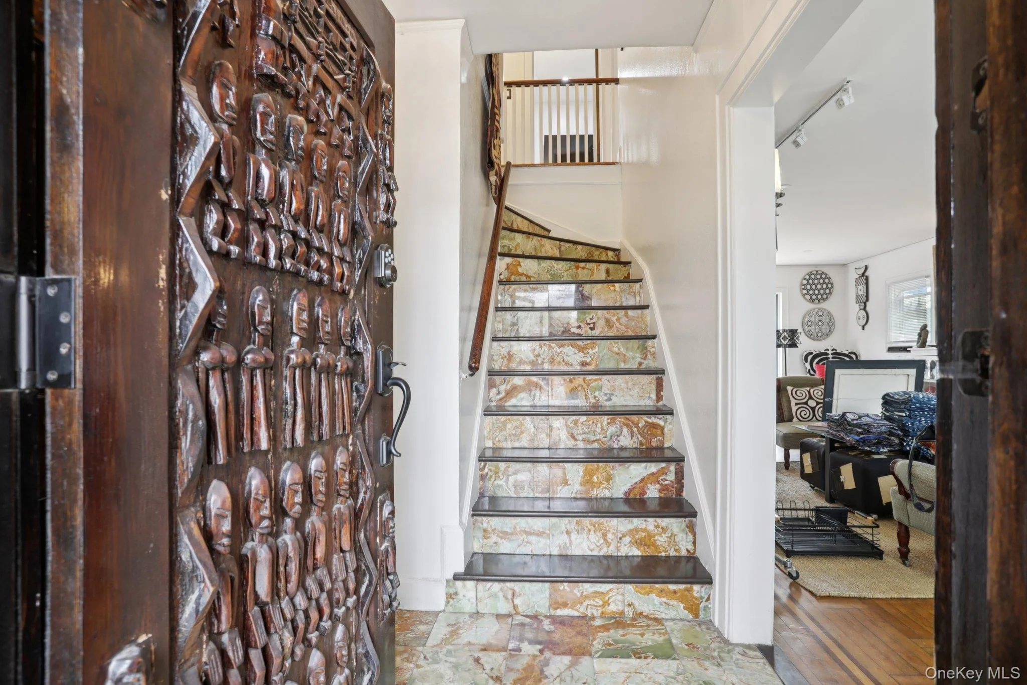 A beautiful sculpted door and artistic stair case A beautiful sculpted door and artistic stair case