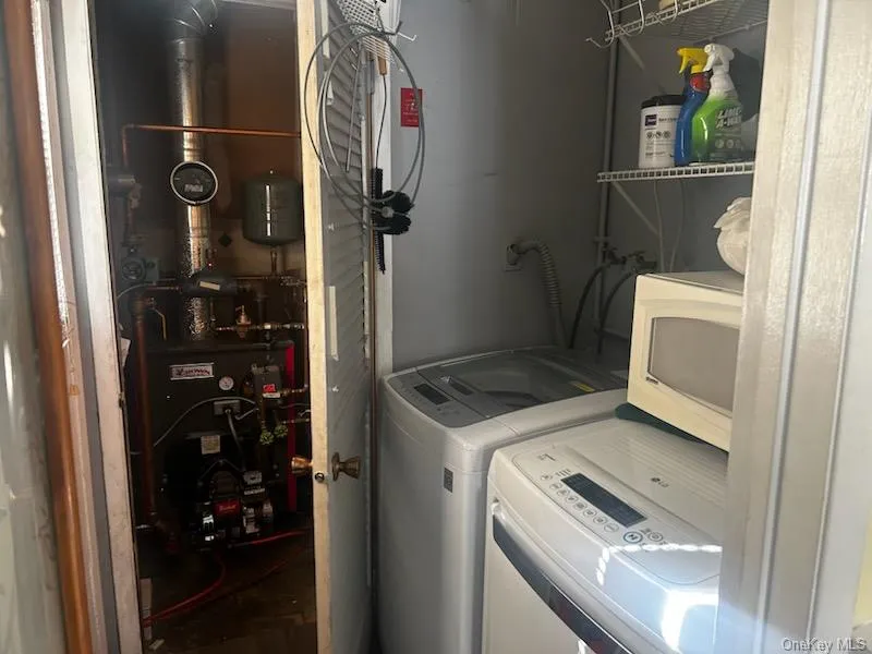 Laundry room with laundry area and washing machine and clothes dryer Laundry room with laundry area and washing machine and clothes dryer