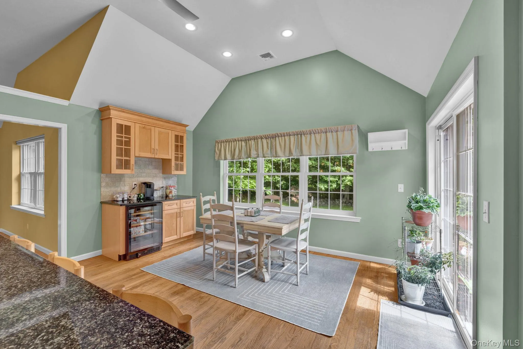 Dine in your kitchen with a brand new built-in beverage refrigerator and sliding glass doors Dine in your kitchen with a brand new built-in beverage refrigerator and sliding glass doors