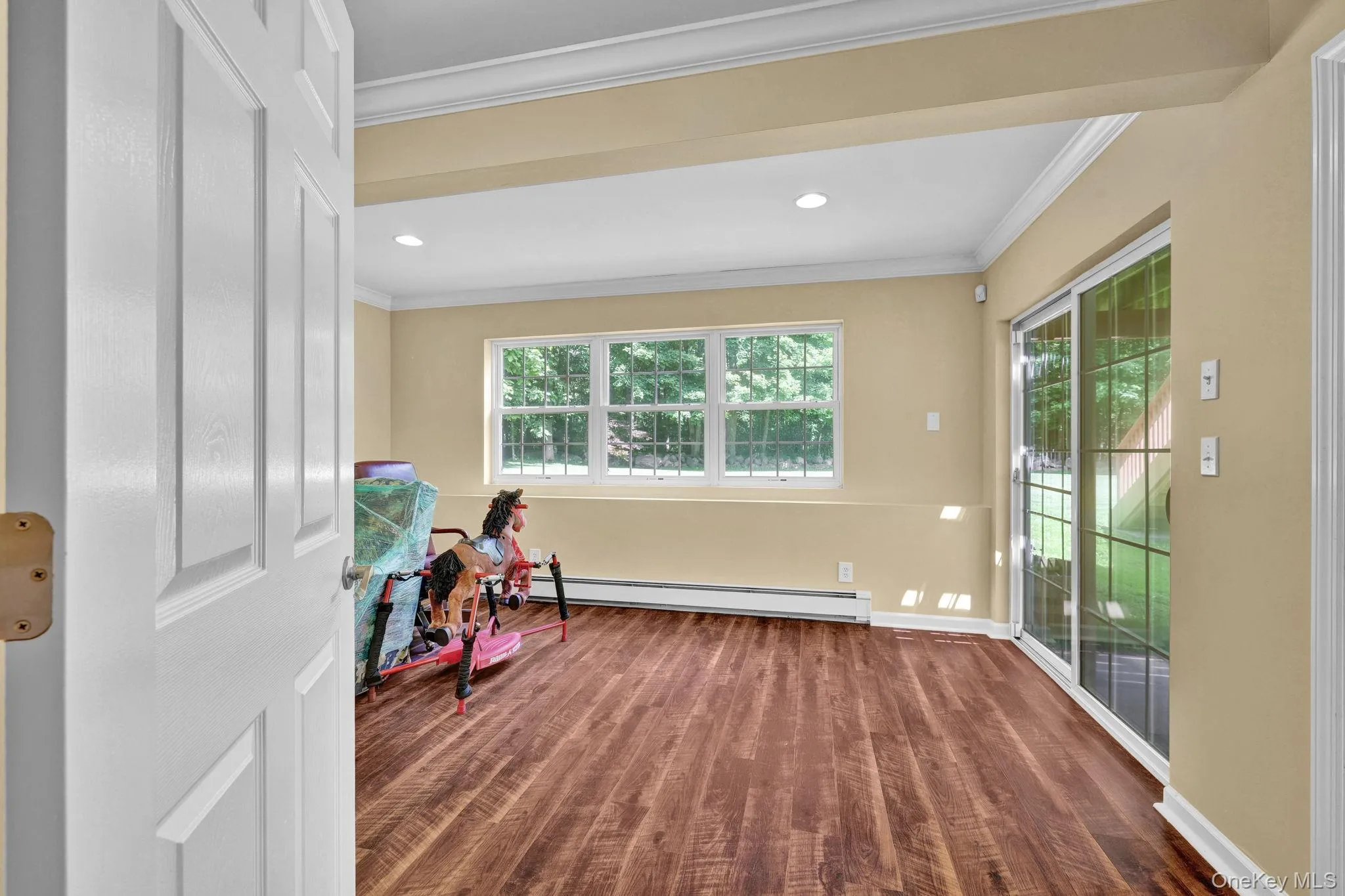 Legal 4th bedroom with new engineered vinyl flooring and sliding doors out to patio Legal 4th bedroom with new engineered vinyl flooring and sliding doors out to patio