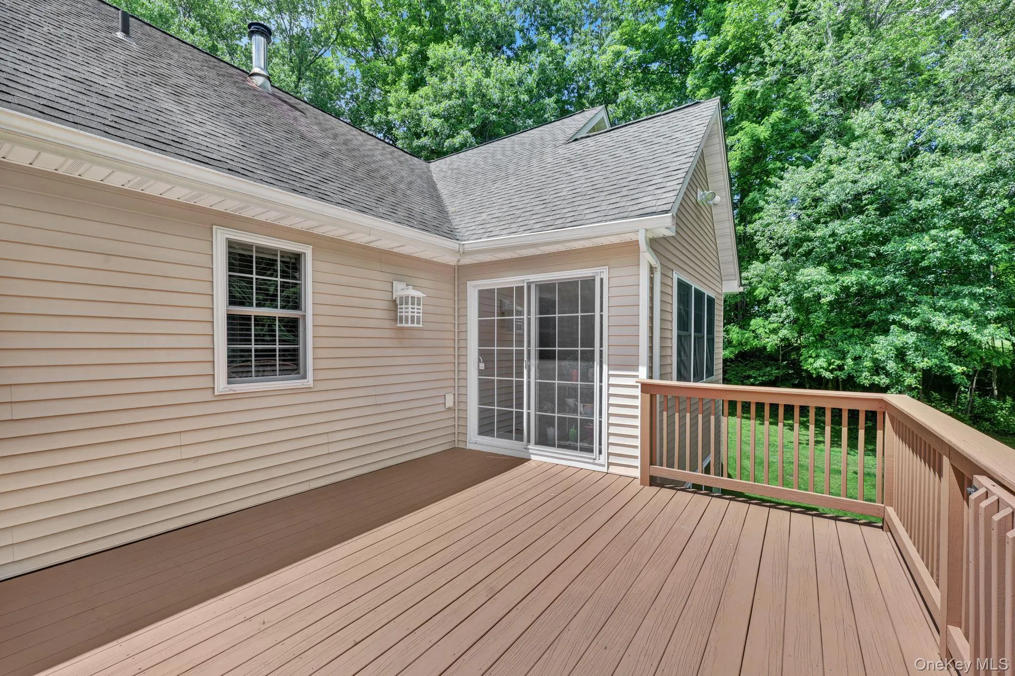 BBQ and entertain! The outdoor deck has wood-finish flooring and matching railings BBQ and entertain! The outdoor deck has wood-finish flooring and matching railings