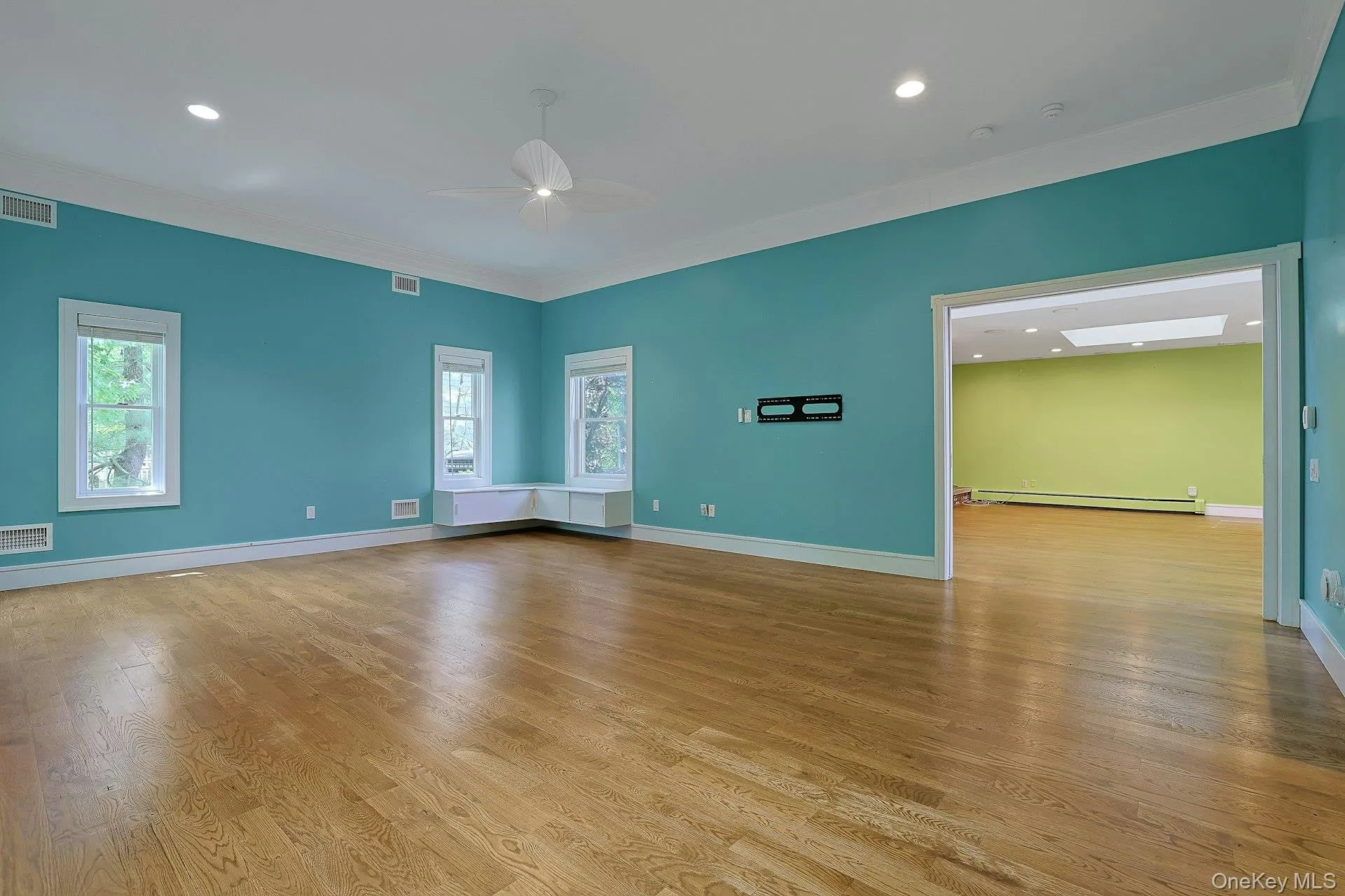 Stunnng wide molding & windows galore add to the ambiance Stunnng wide molding & windows galore add to the ambiance