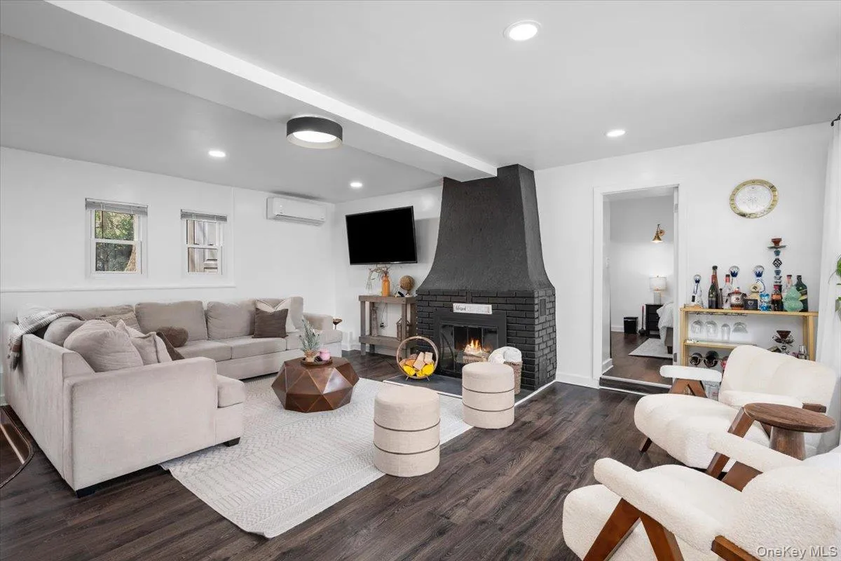 The Living Room with a Wood Burning Fireplace The Living Room with a Wood Burning Fireplace