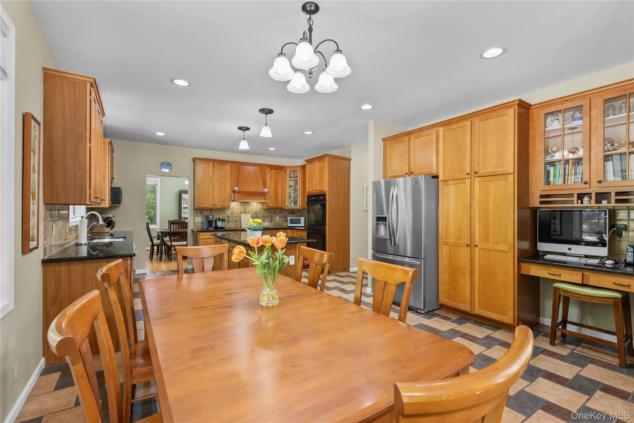 Eat in kitchen with desk or bar area that leads to dining room Eat in kitchen with desk or bar area that leads to dining room