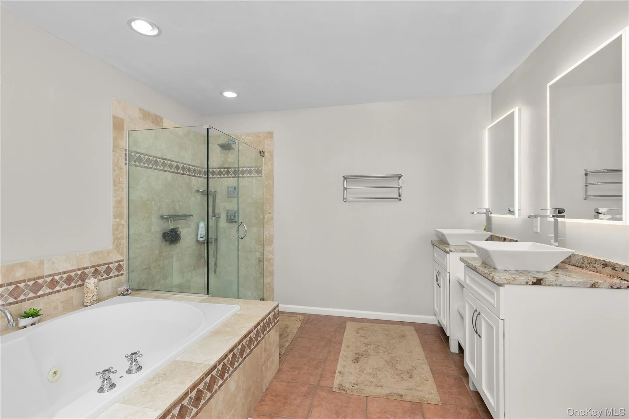 with walk in shower, vanity with dual sinks, whirlpool tub with walk in shower, vanity with dual sinks, whirlpool tub
