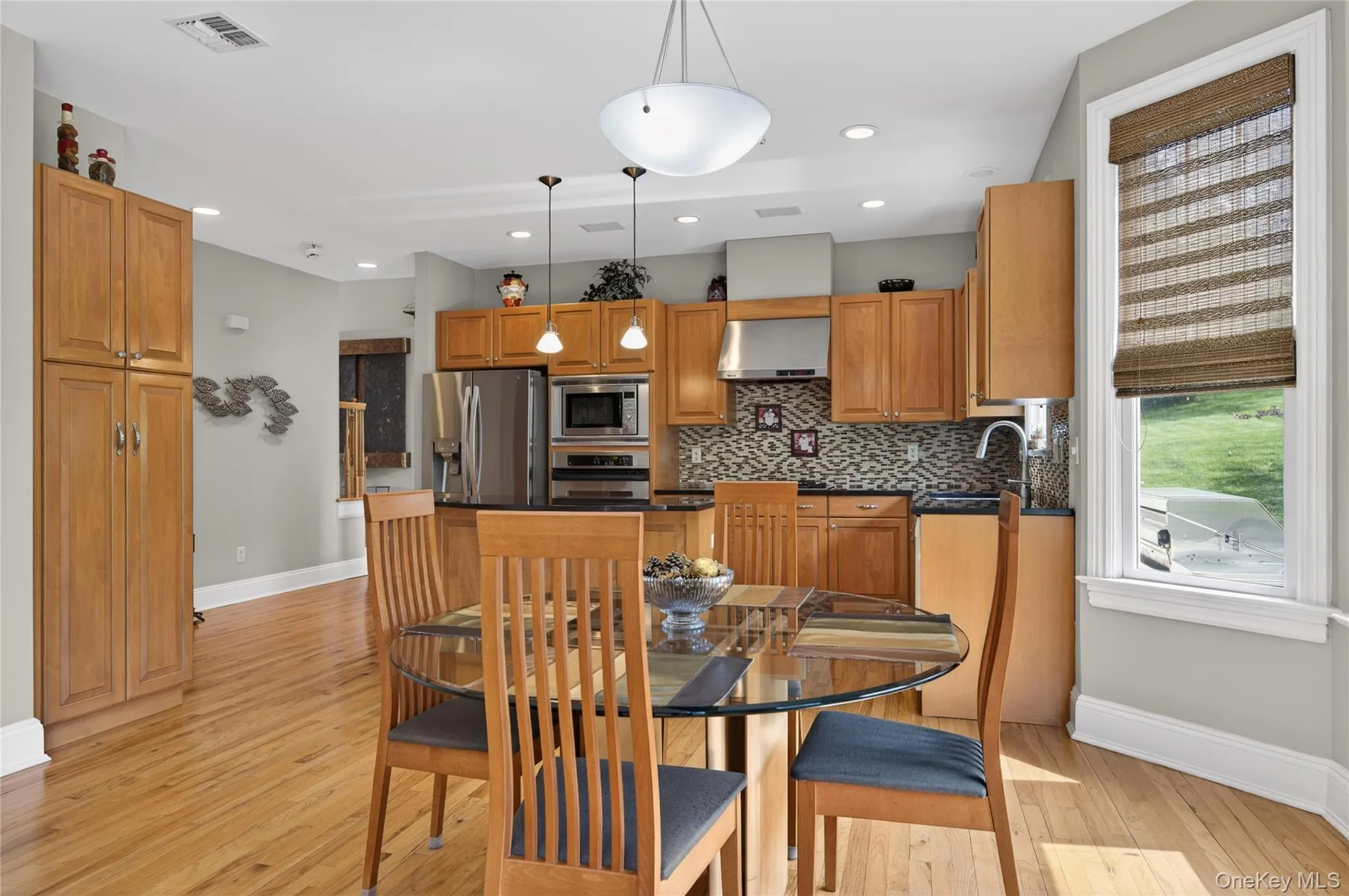 Kitchen with wood cabinetry and eat-in-kitchen Kitchen with wood cabinetry and eat-in-kitchen