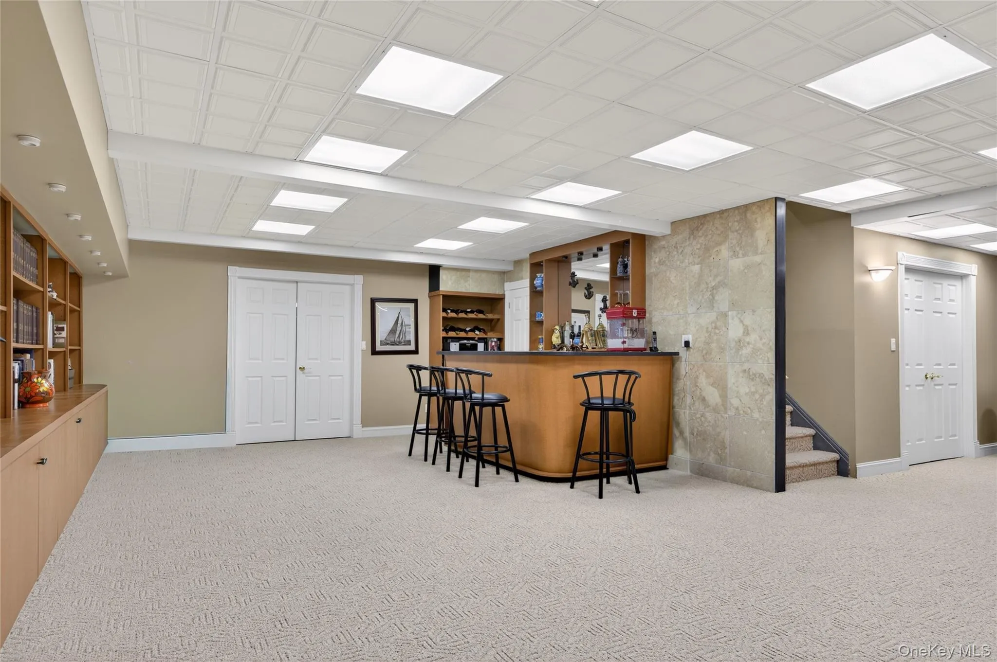 Spacious basement featuring a built-in bar Spacious basement featuring a built-in bar