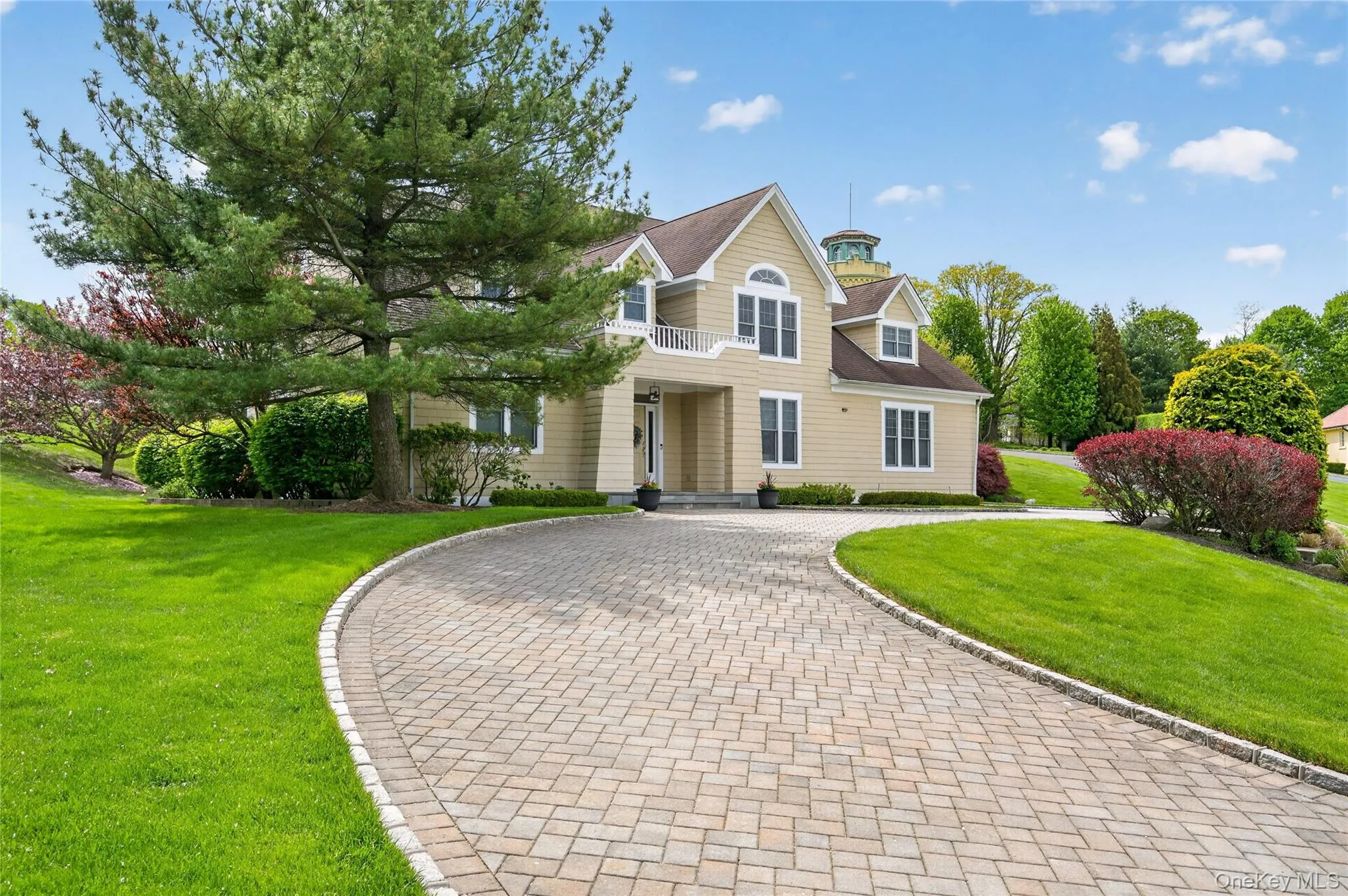 Front of home, with large paver driveway Front of home, with large paver driveway