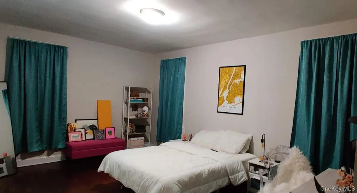 Bedroom featuring wood finished floors Bedroom featuring wood finished floors
