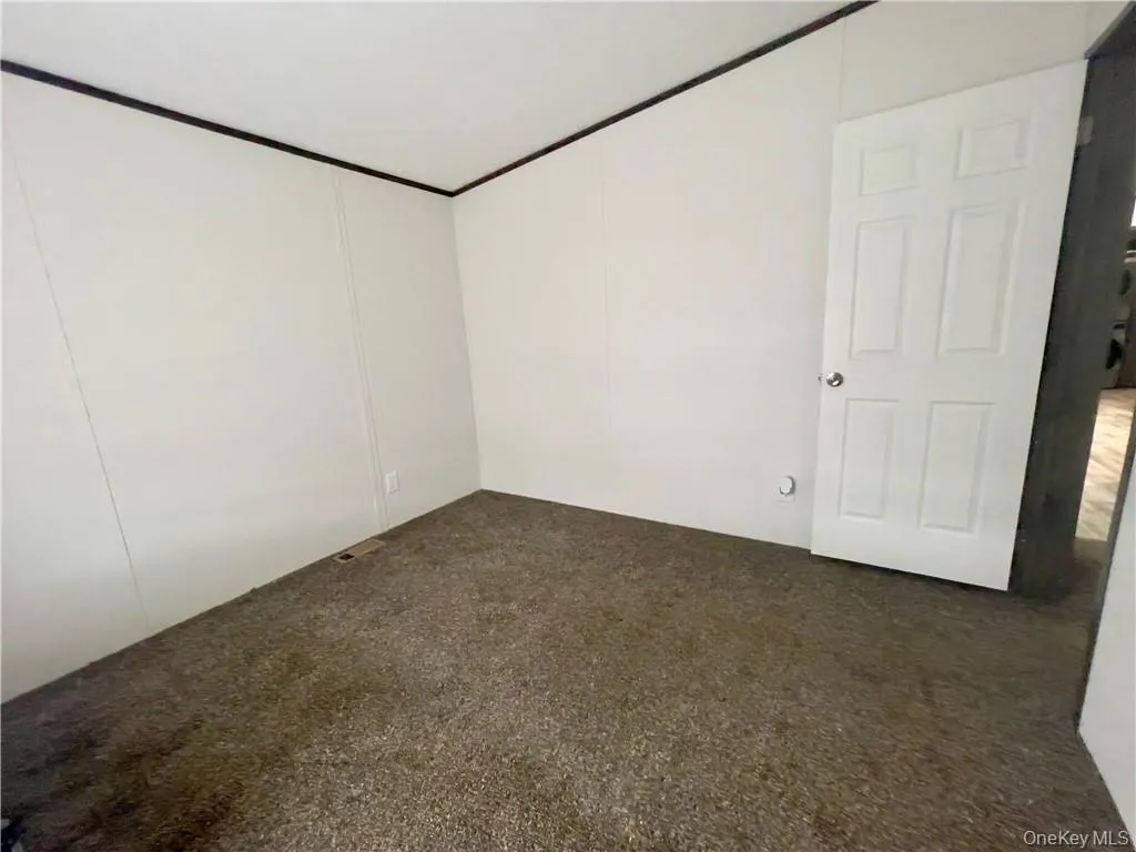 View of carpeted empty room View of carpeted empty room