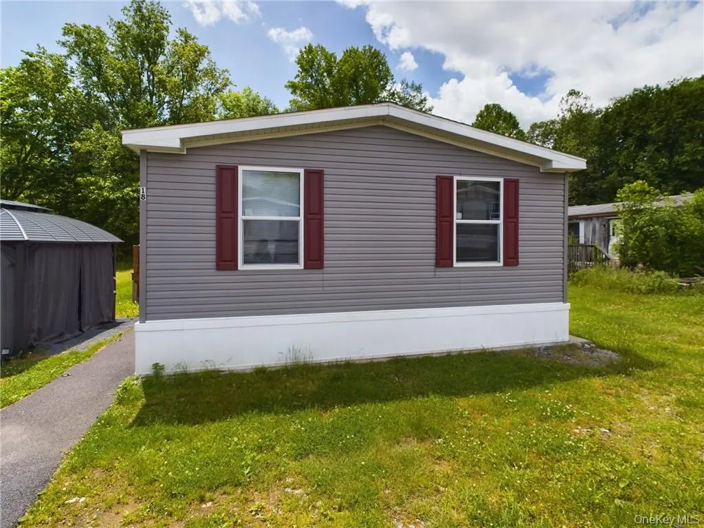 View of side of property with a lawn View of side of property with a lawn