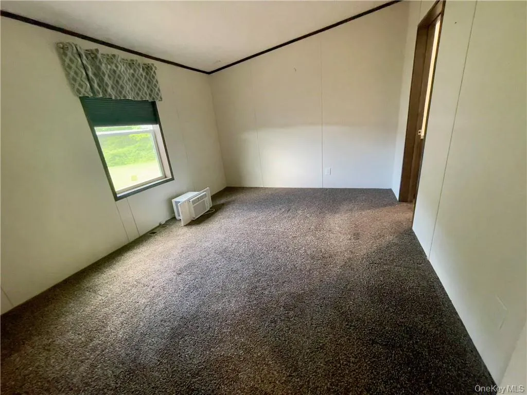 View of carpeted spare room View of carpeted spare room