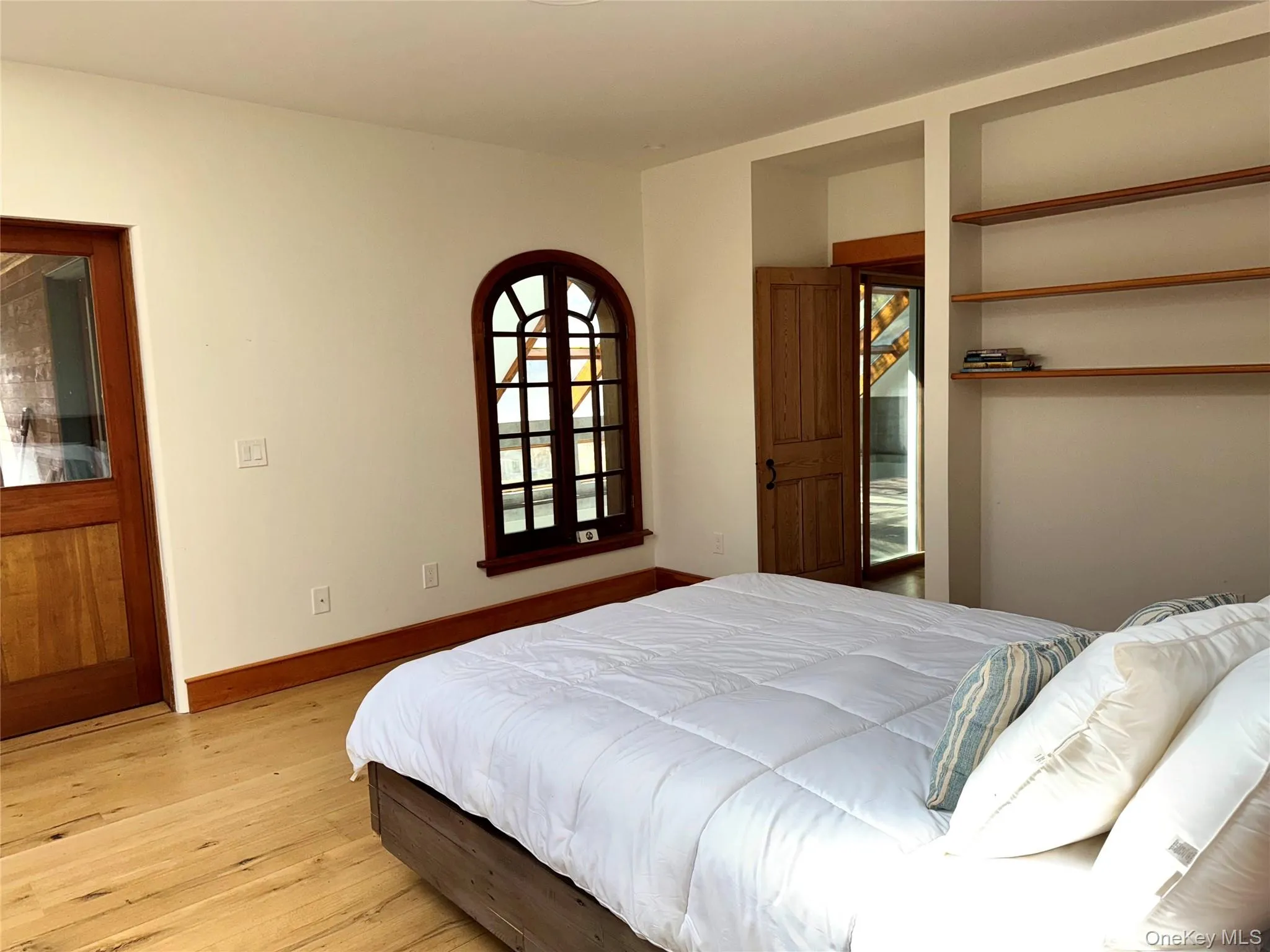 Primary Bedroom has Walk-in Closet & Door to Screened Porch Primary Bedroom has Walk-in Closet & Door to Screened Porch