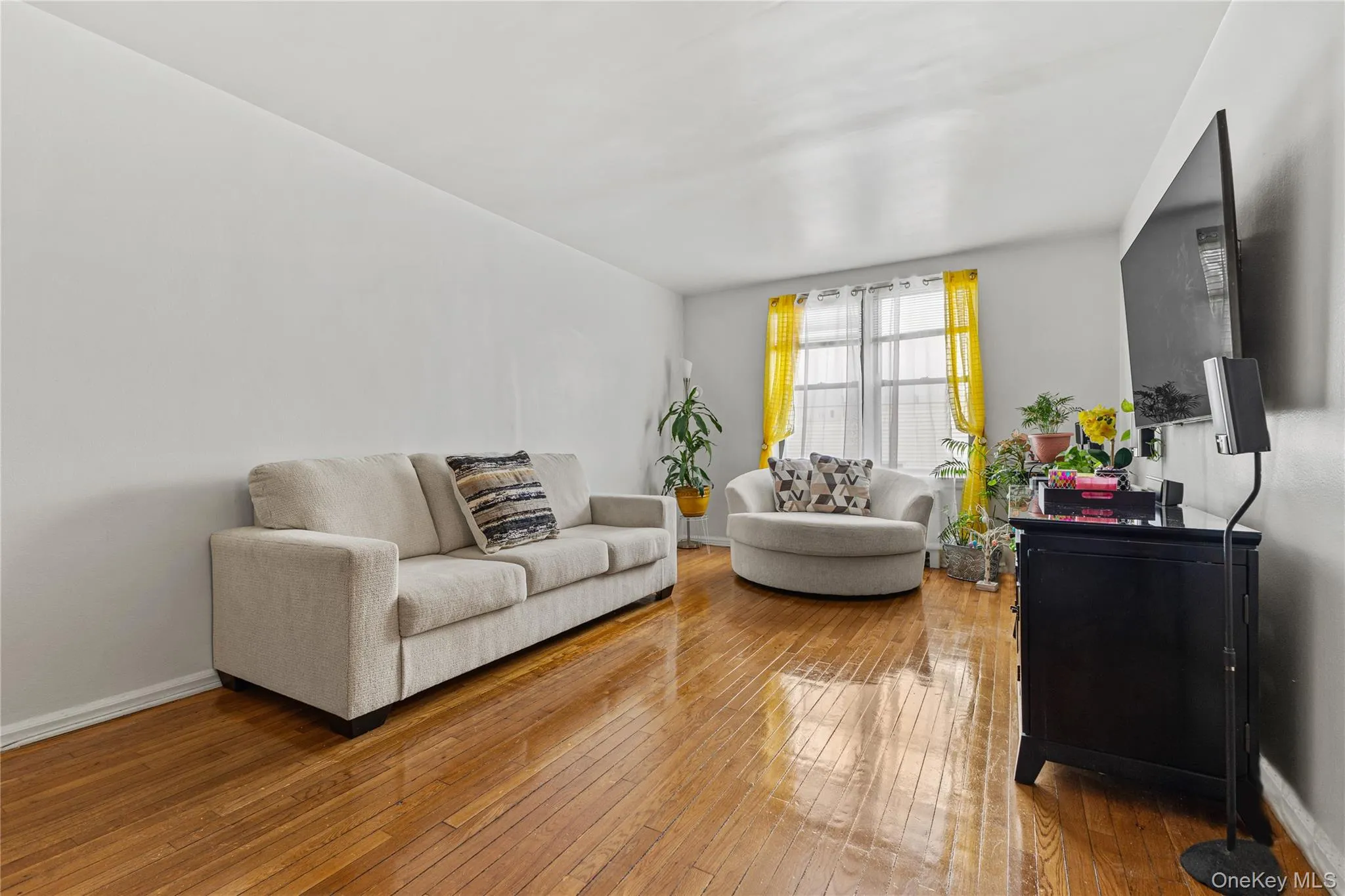 The expansive living room is over 20' long with hardwood floors and . . . The expansive living room is over 20' long with hardwood floors and . . .