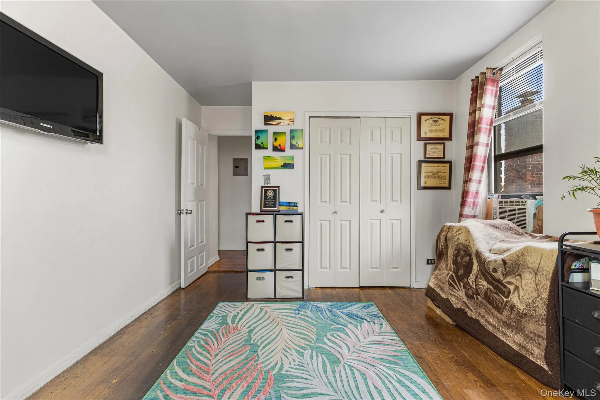 a double closet behind bi-fold doors. a double closet behind bi-fold doors.