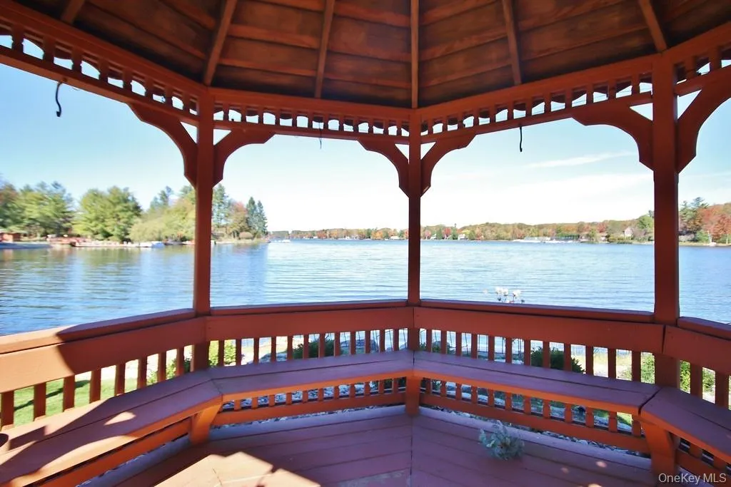 Dock featuring a water view and a gazebo Dock featuring a water view and a gazebo
