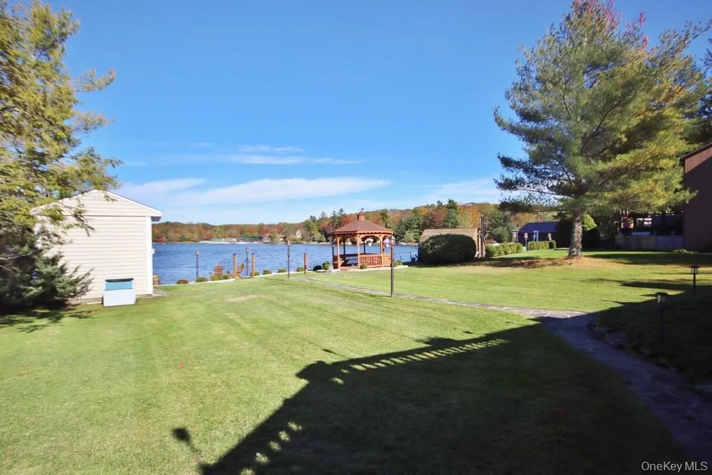 View of grassy yard with a water view and a gazebo View of grassy yard with a water view and a gazebo