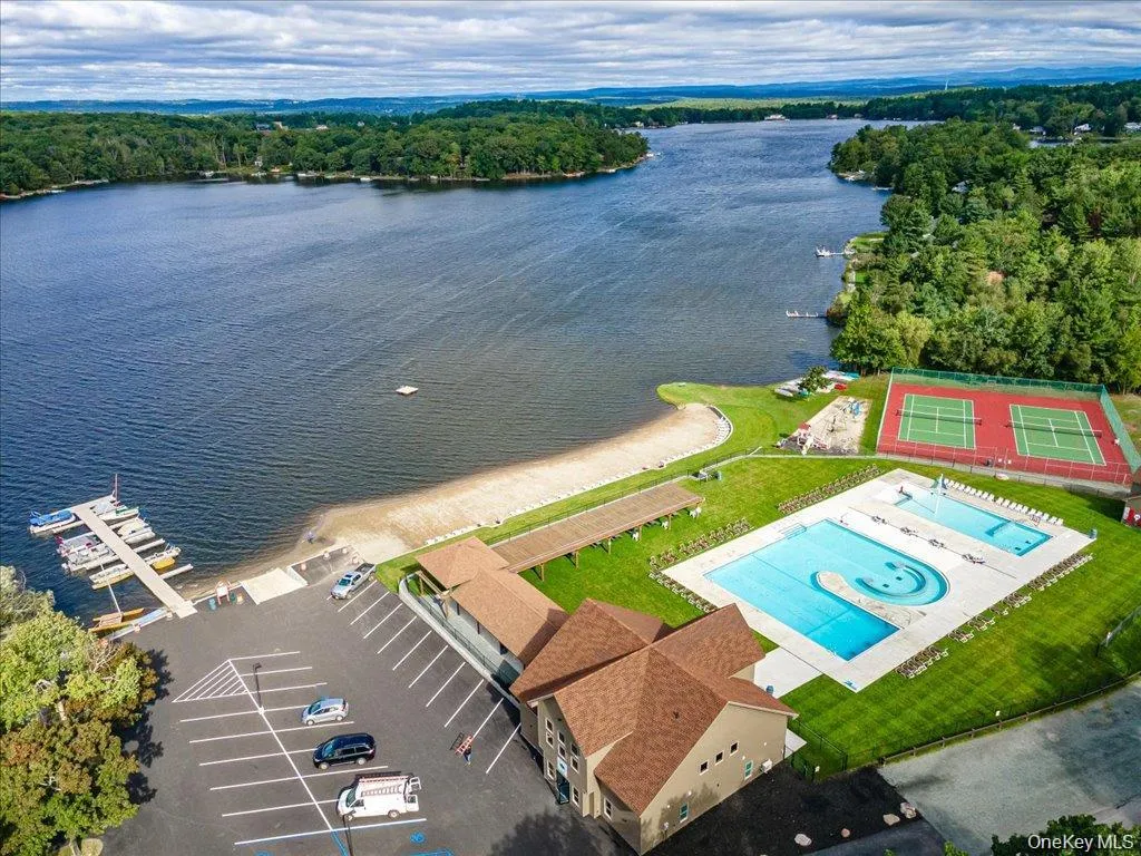 Drone / aerial view of a large body of water and a pool area Drone / aerial view of a large body of water and a pool area