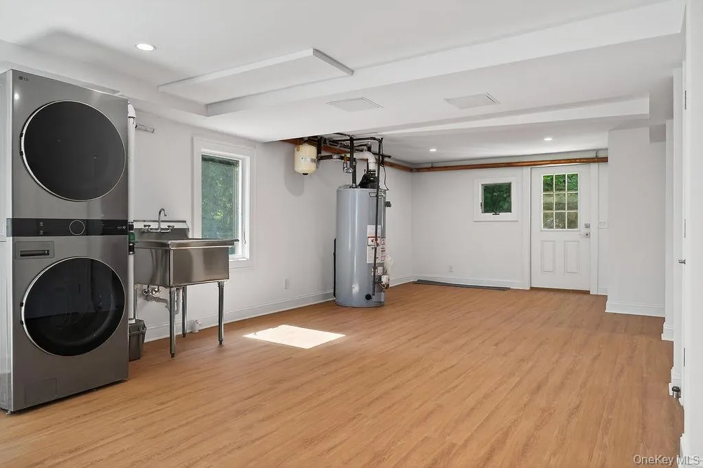 New full size washer and dryer, utility sink and water heater. Flooring is luxury vinyl. New full size washer and dryer, utility sink and water heater. Flooring is luxury vinyl.