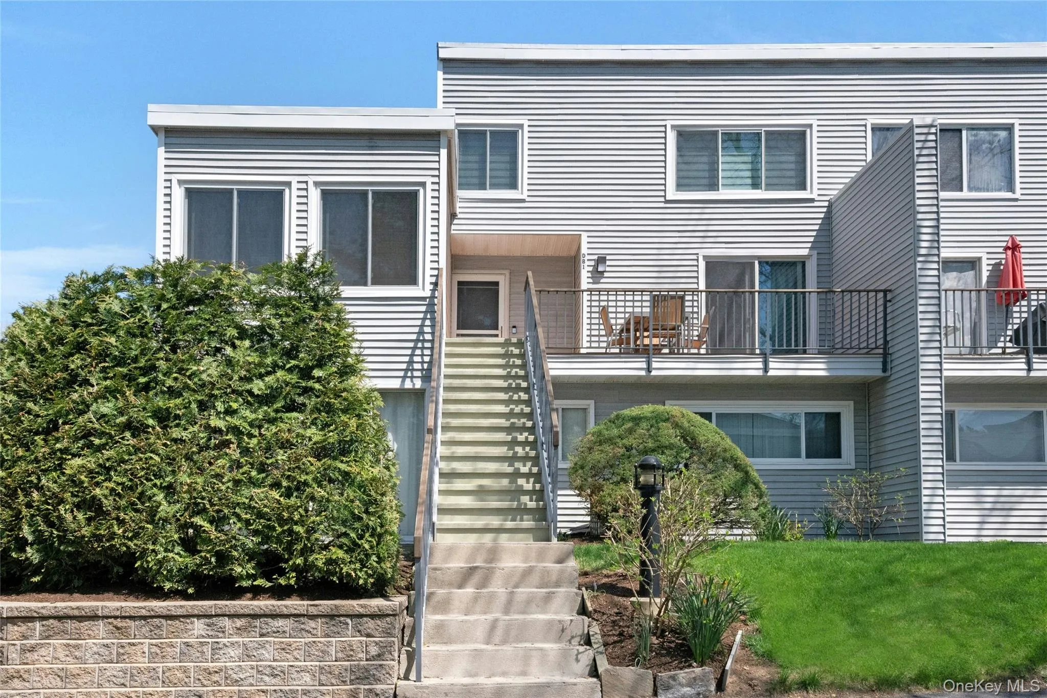 Exterior featuring an outdoor staircase with handrails, and a private balcony Exterior featuring an outdoor staircase with handrails, and a private balcony
