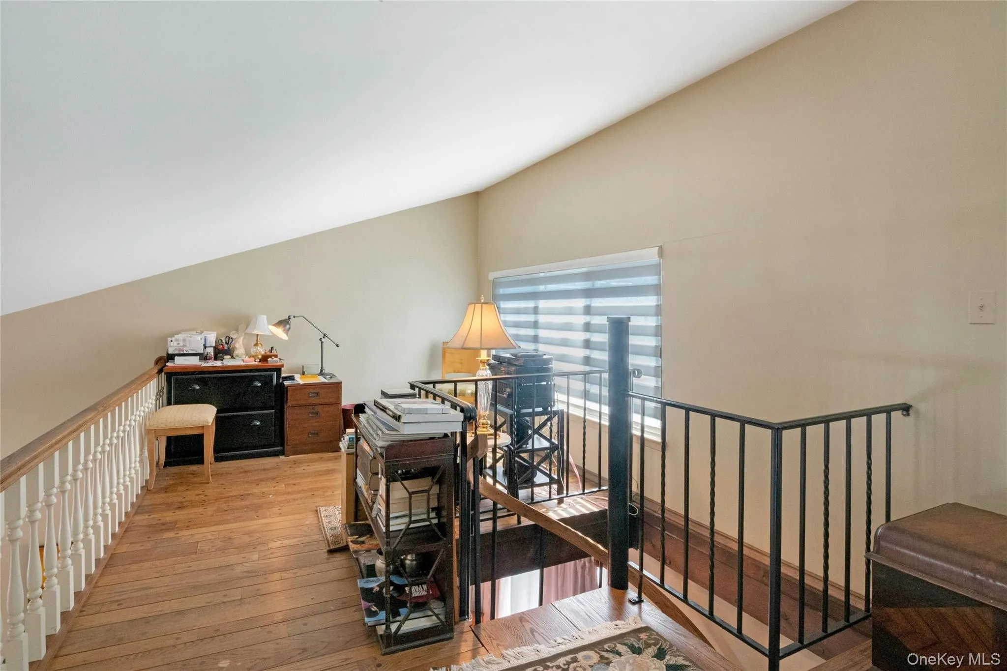 Loft area can serve as an office, additional living space, or guest area, and includes built-in custom storage. Loft area can serve as an office, additional living space, or guest area, and includes built-in custom storage.