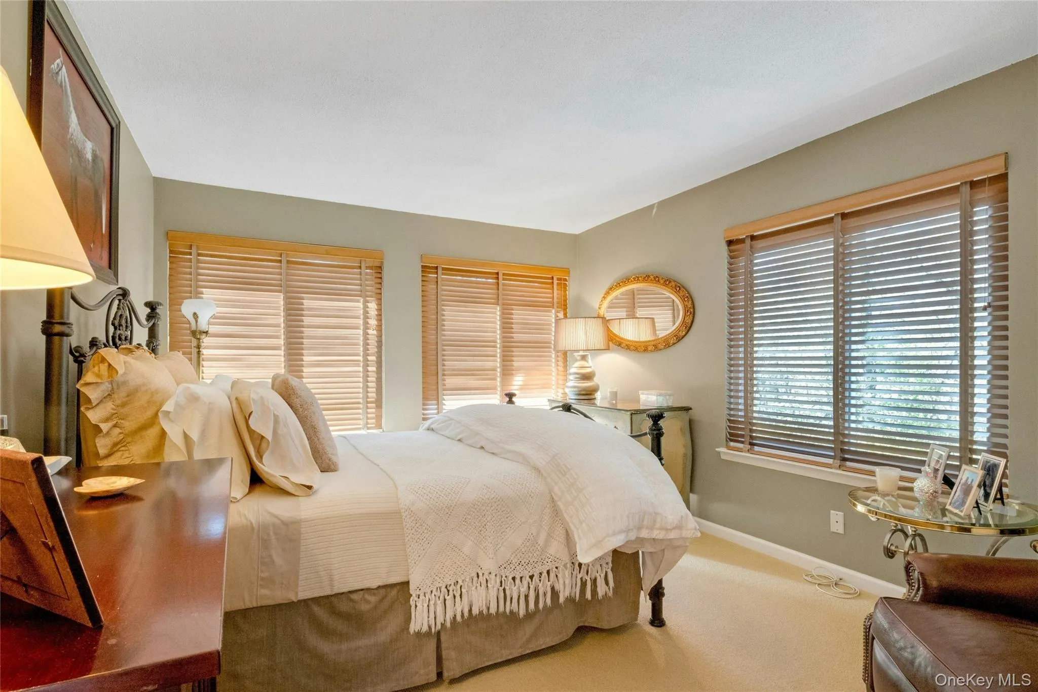 Wall-to-wall carpeting in a neutral tone, complemented by light grey wall paint Wall-to-wall carpeting in a neutral tone, complemented by light grey wall paint