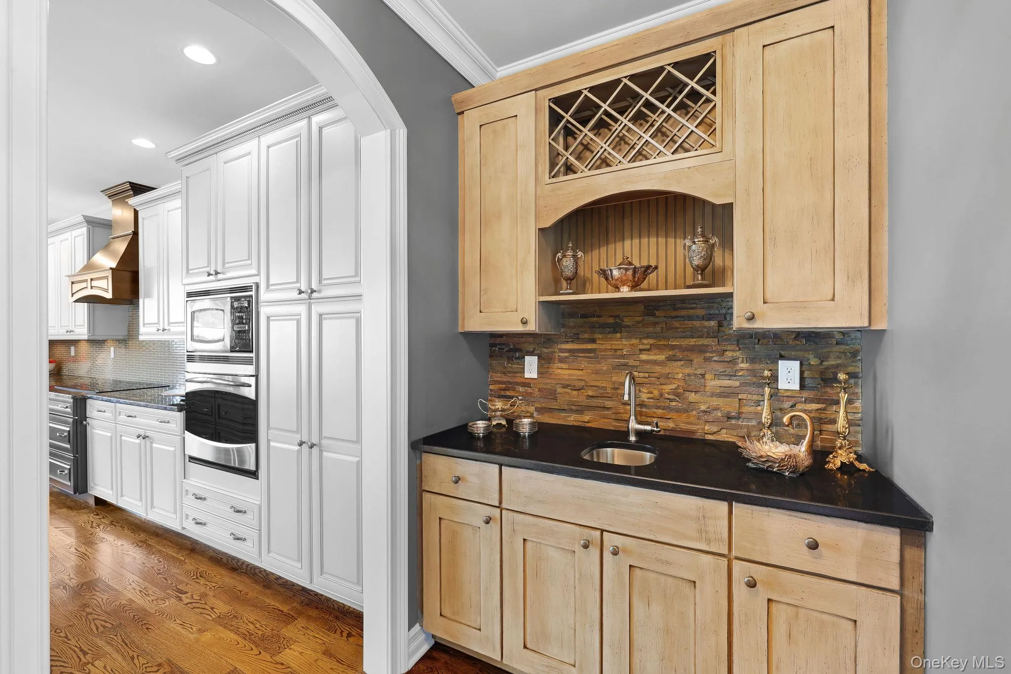 Butler's pantry with storage and extra entertaining space between kitchen/dining room Butler's pantry with storage and extra entertaining space between kitchen/dining room