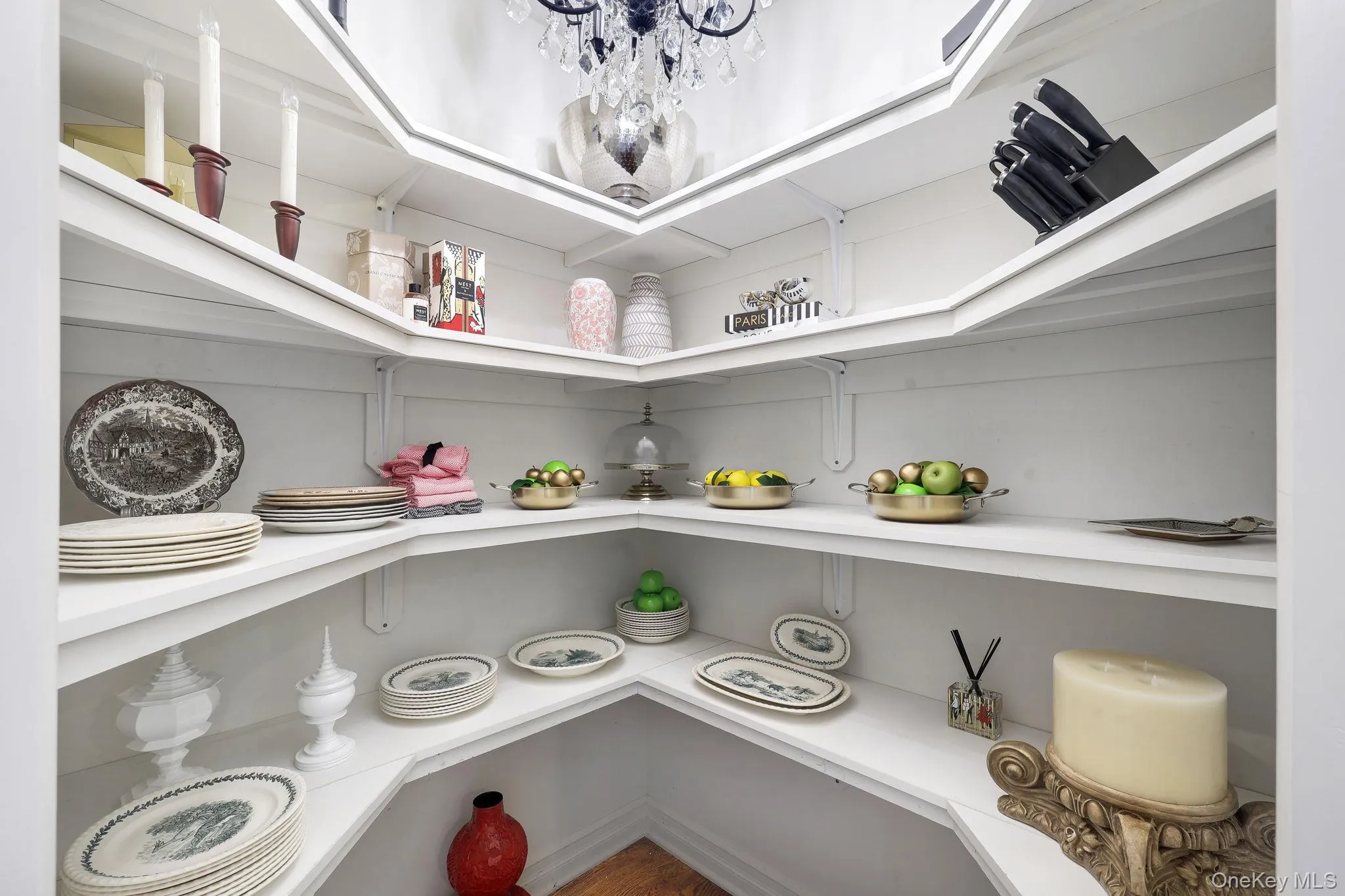 Very large built-in pantry closet with lots of shelving with white finishes Very large built-in pantry closet with lots of shelving with white finishes