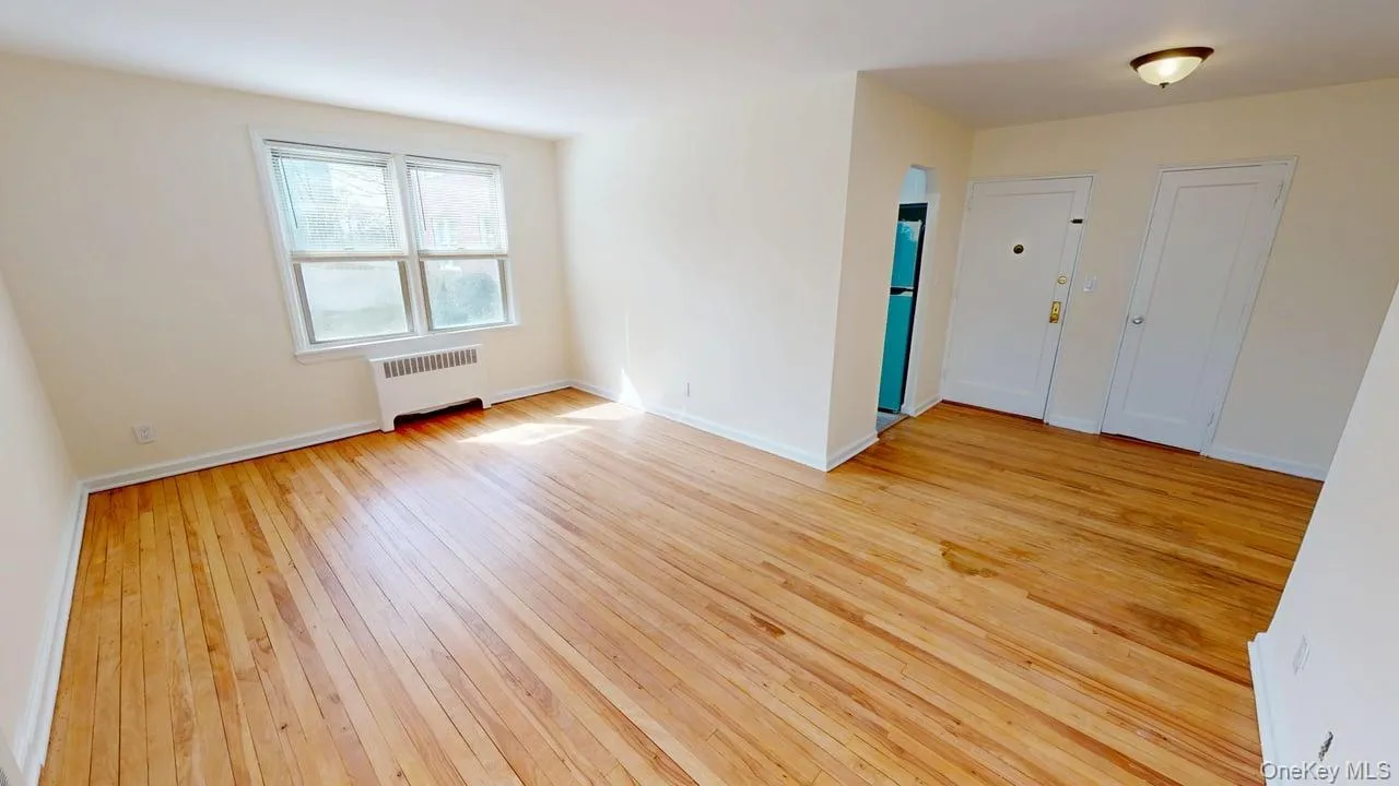 Living Room was freshly painted with wooded floors Living Room was freshly painted with wooded floors