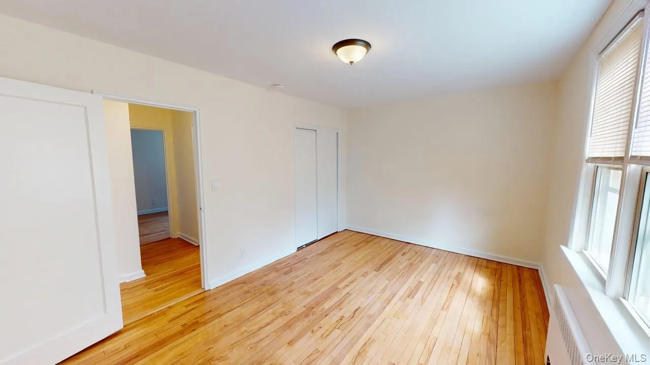 This is 1st bed room features warm wood floors, freshly panted. This is 1st bed room features warm wood floors, freshly panted.