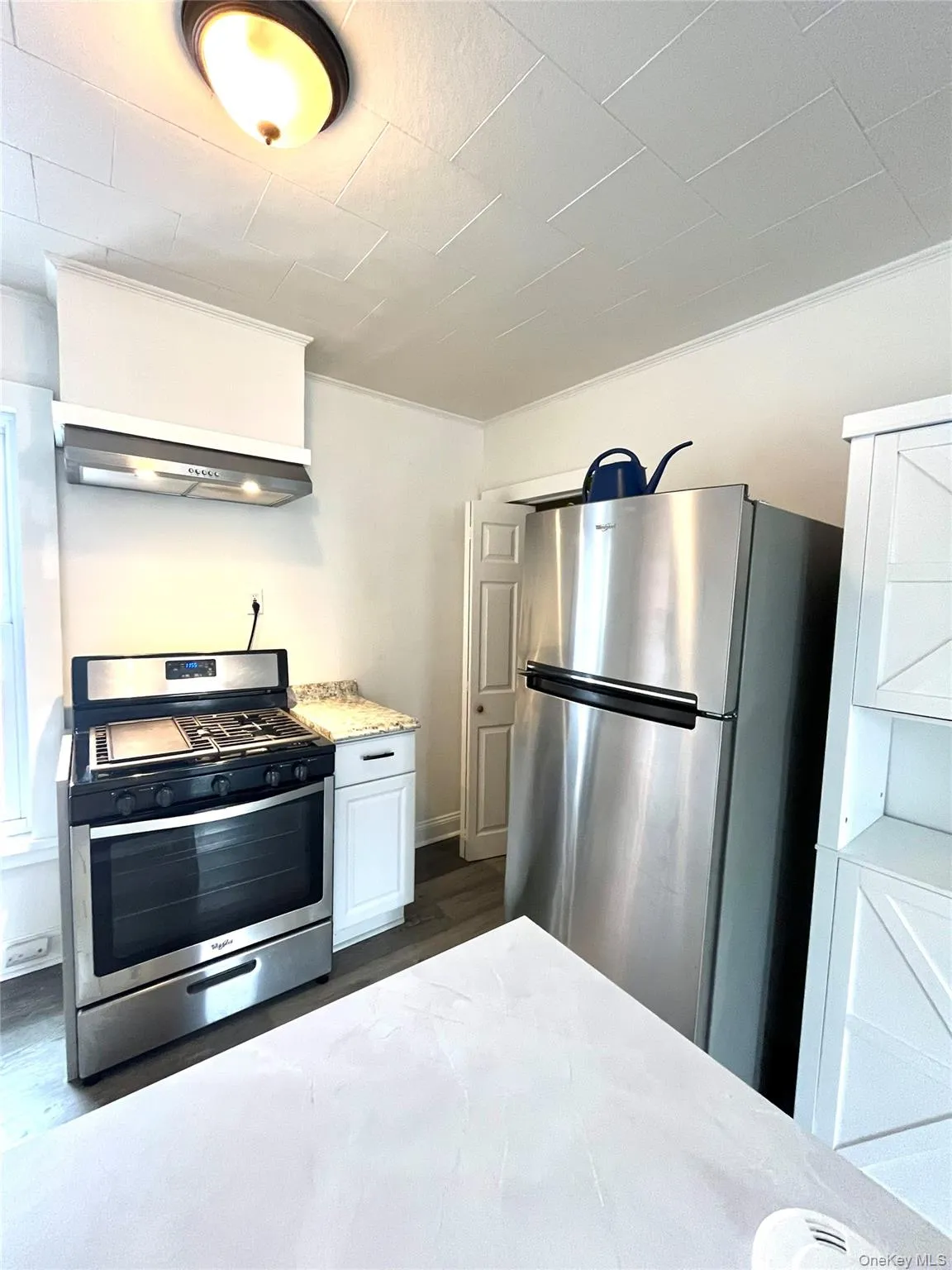 Fridge and range. Pantry in the corner Fridge and range. Pantry in the corner