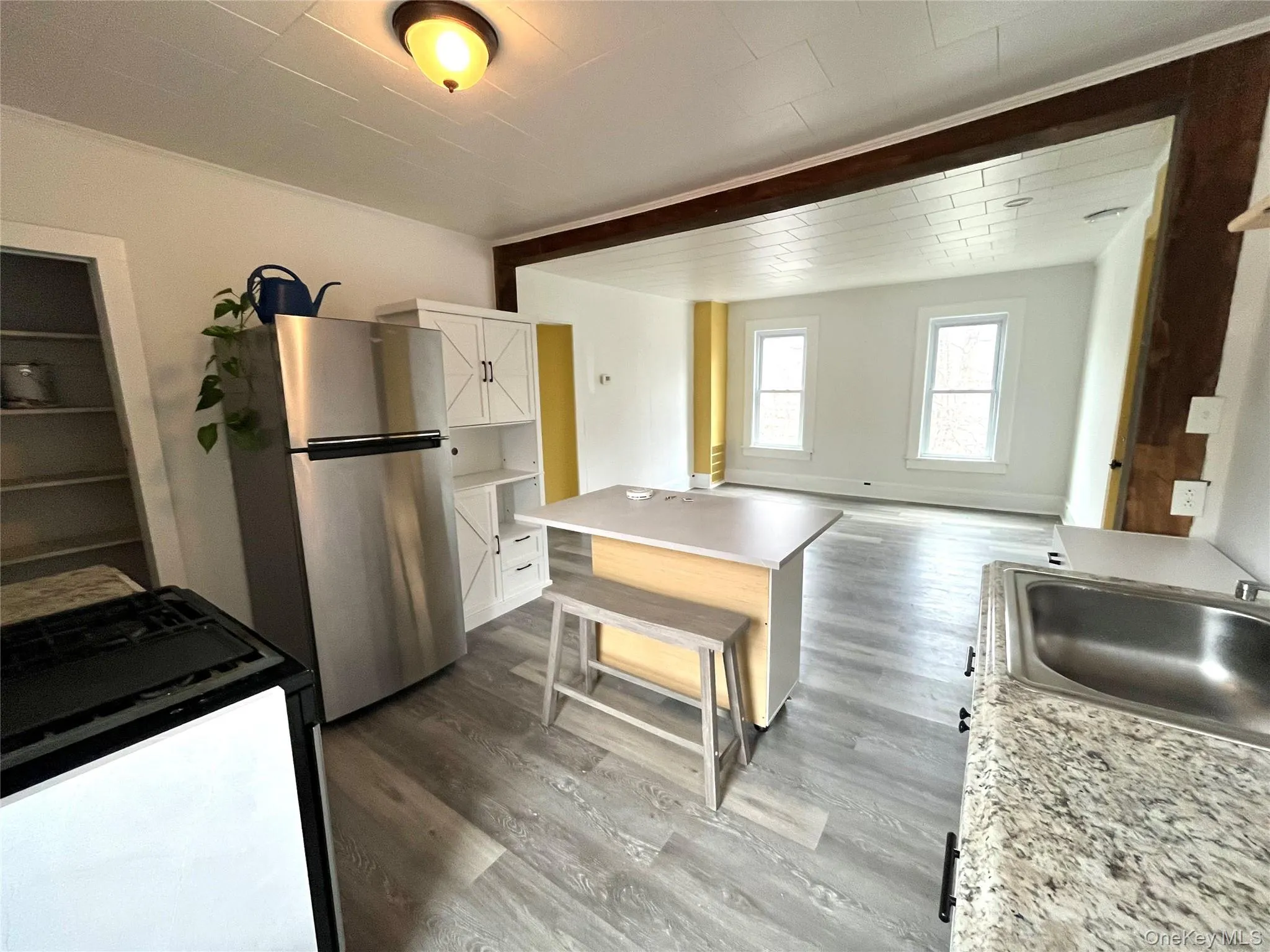 This pic is taken from the door to the bathroom through the kitchen into the spacious living room This pic is taken from the door to the bathroom through the kitchen into the spacious living room