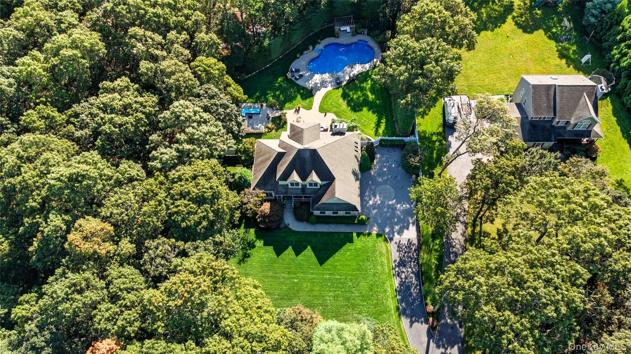 View of subject property with a pool View of subject property with a pool