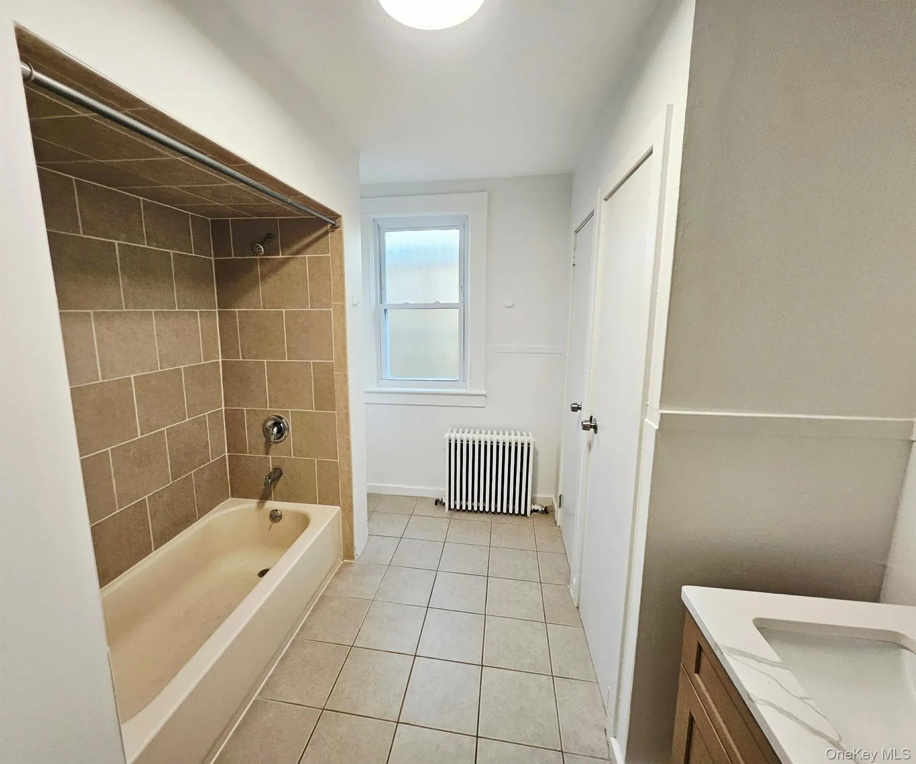 Huge bathroom with window and linen closet. Huge bathroom with window and linen closet.
