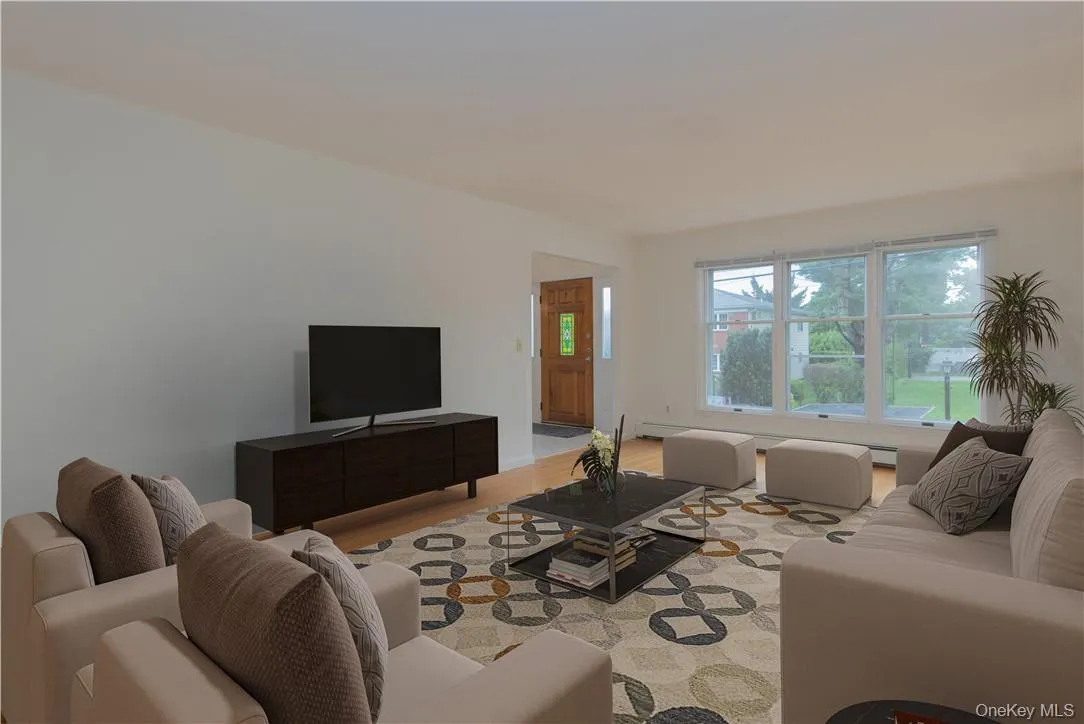 Front living room with digital staging. Front living room with digital staging.