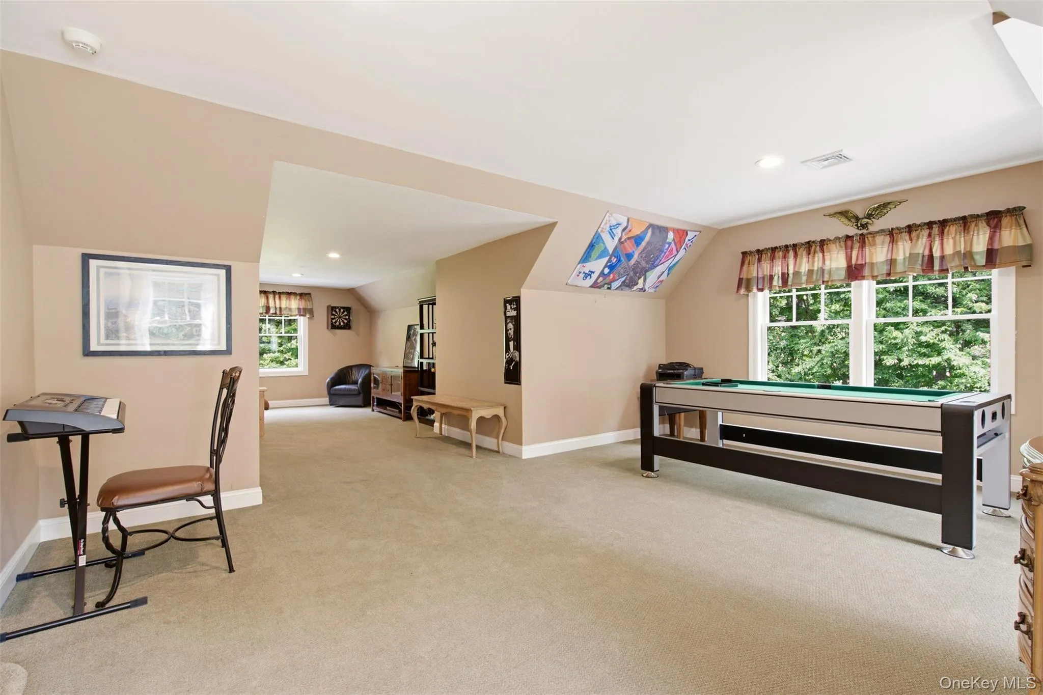 Expansive game room just up backstairs from kitchen Expansive game room just up backstairs from kitchen