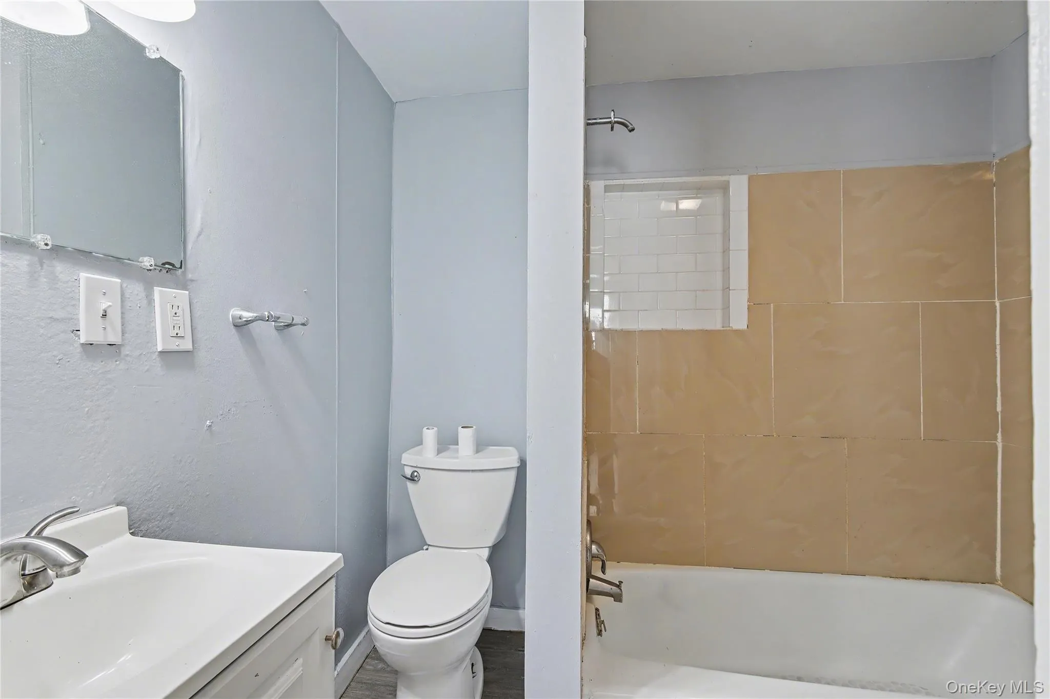 Full bathroom featuring vanity and shower / bathtub combination Full bathroom featuring vanity and shower / bathtub combination